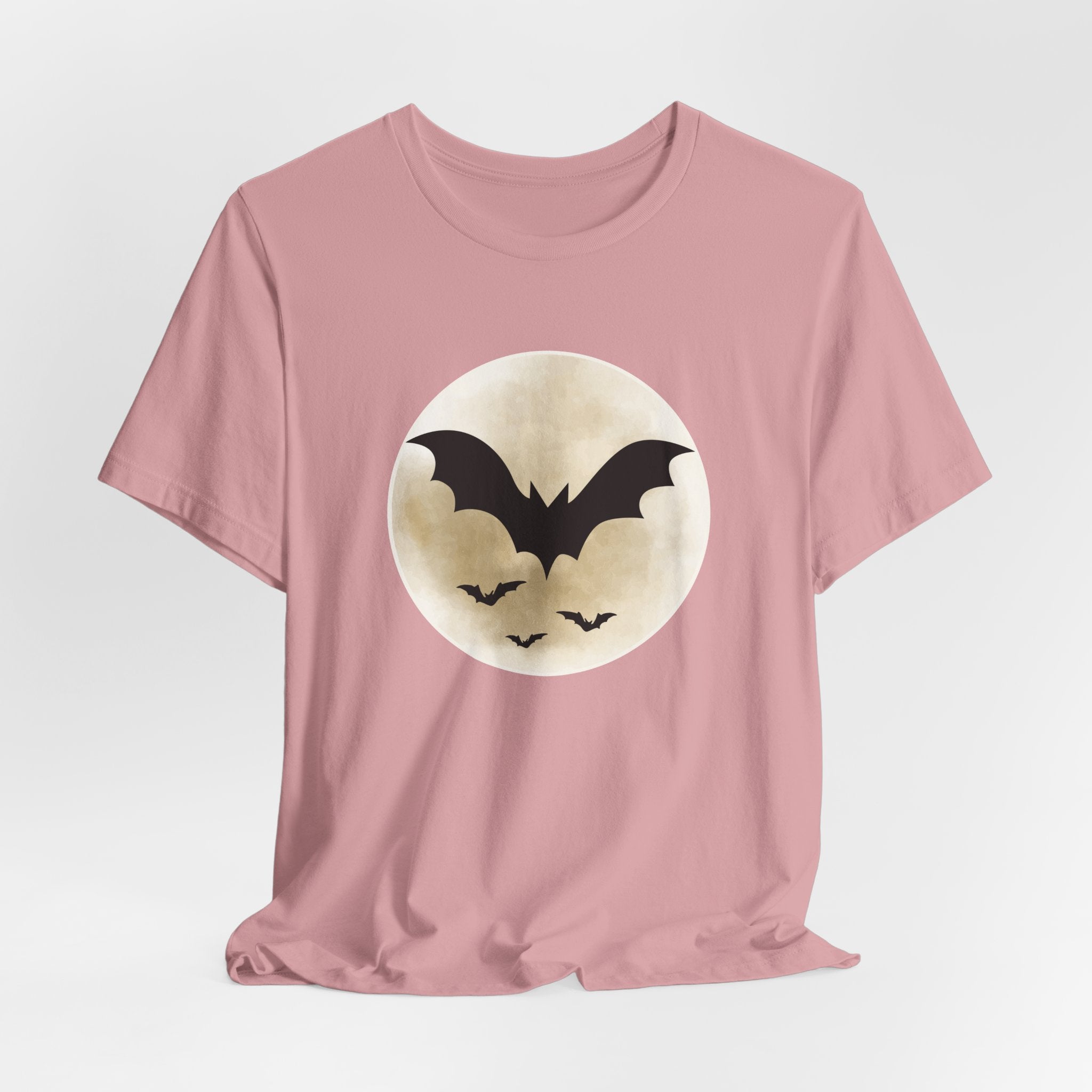 Orchid pink t-shirt with full moon and bats design on a light gray background