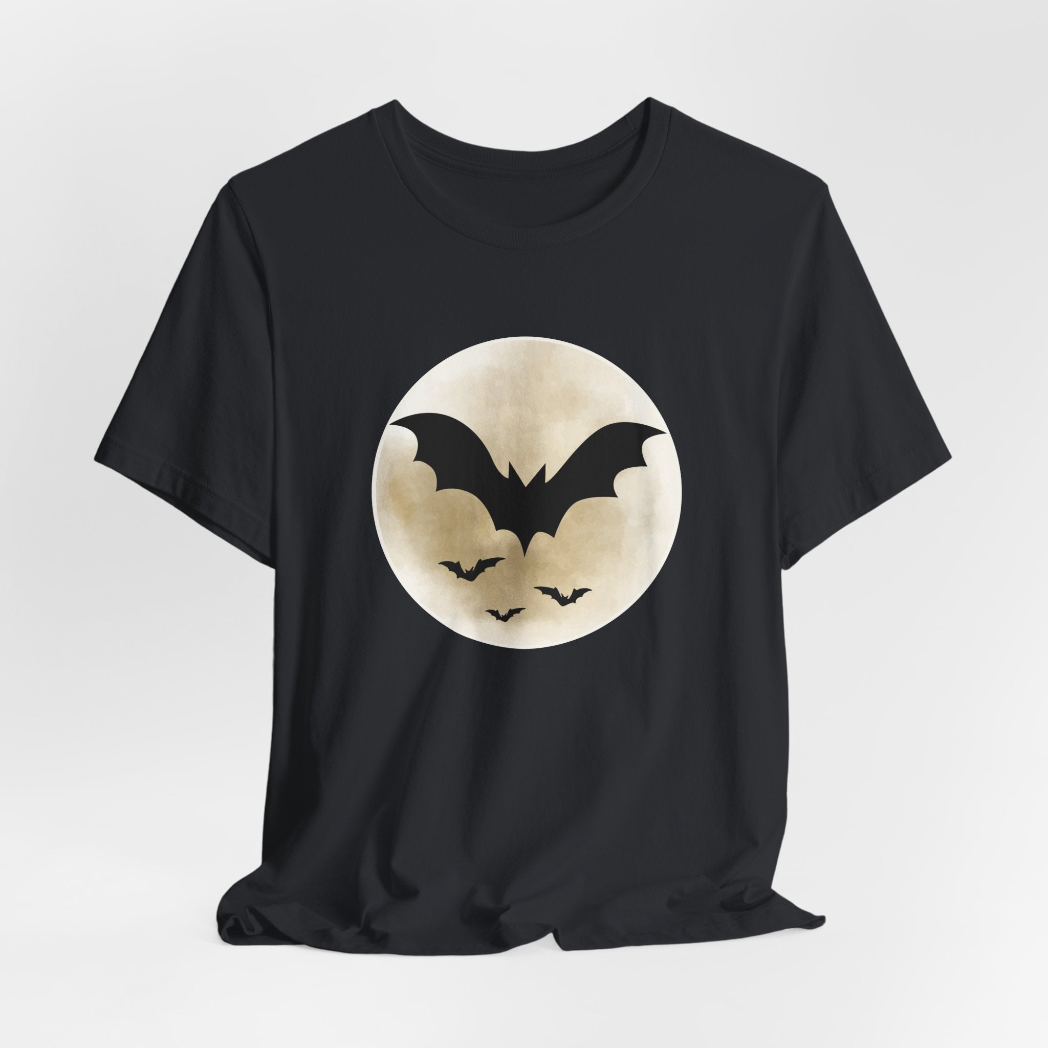 Vintage black t-shirt with full moon and bats design on a light gray background