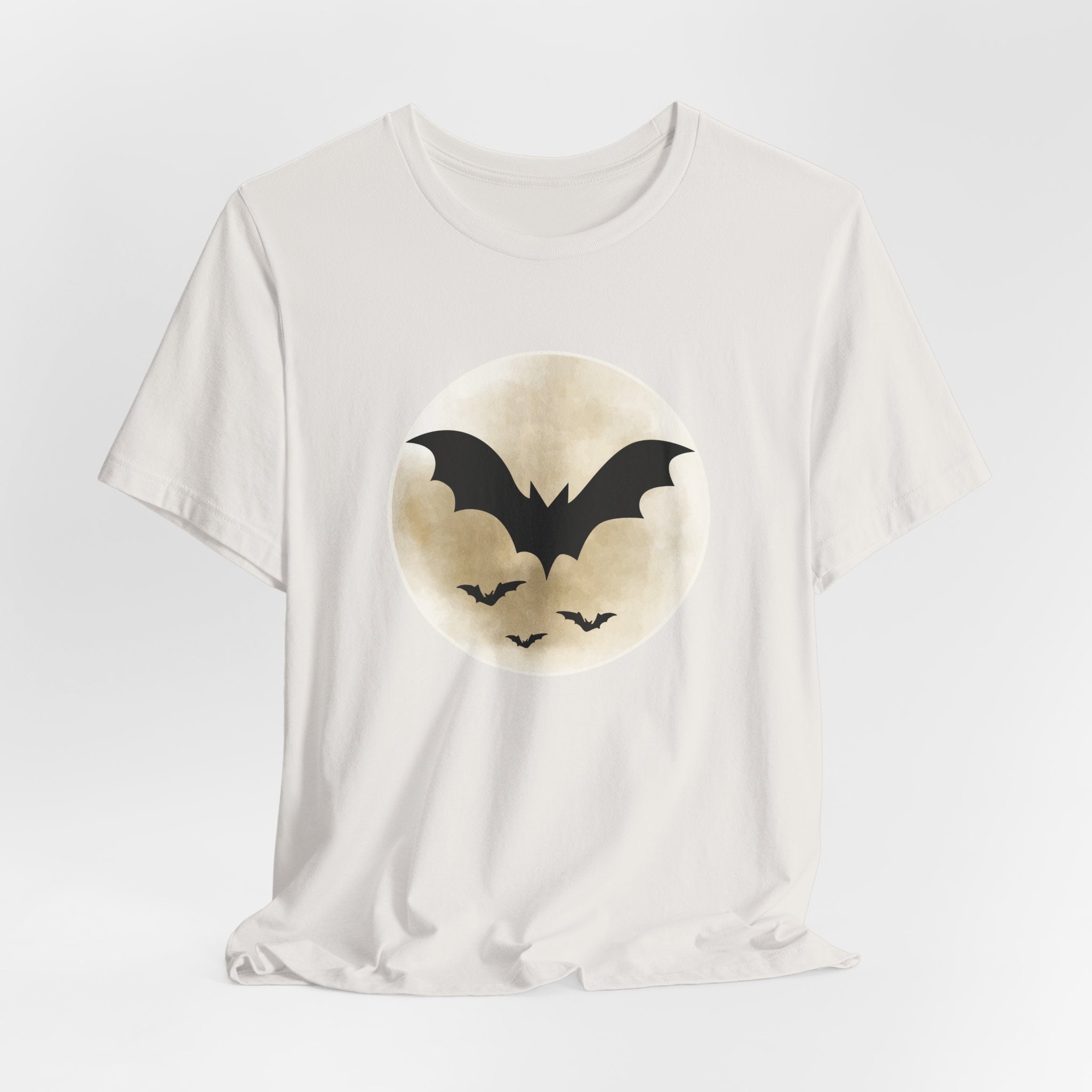 Vintage white t-shirt with full moon and bats design on a light gray background