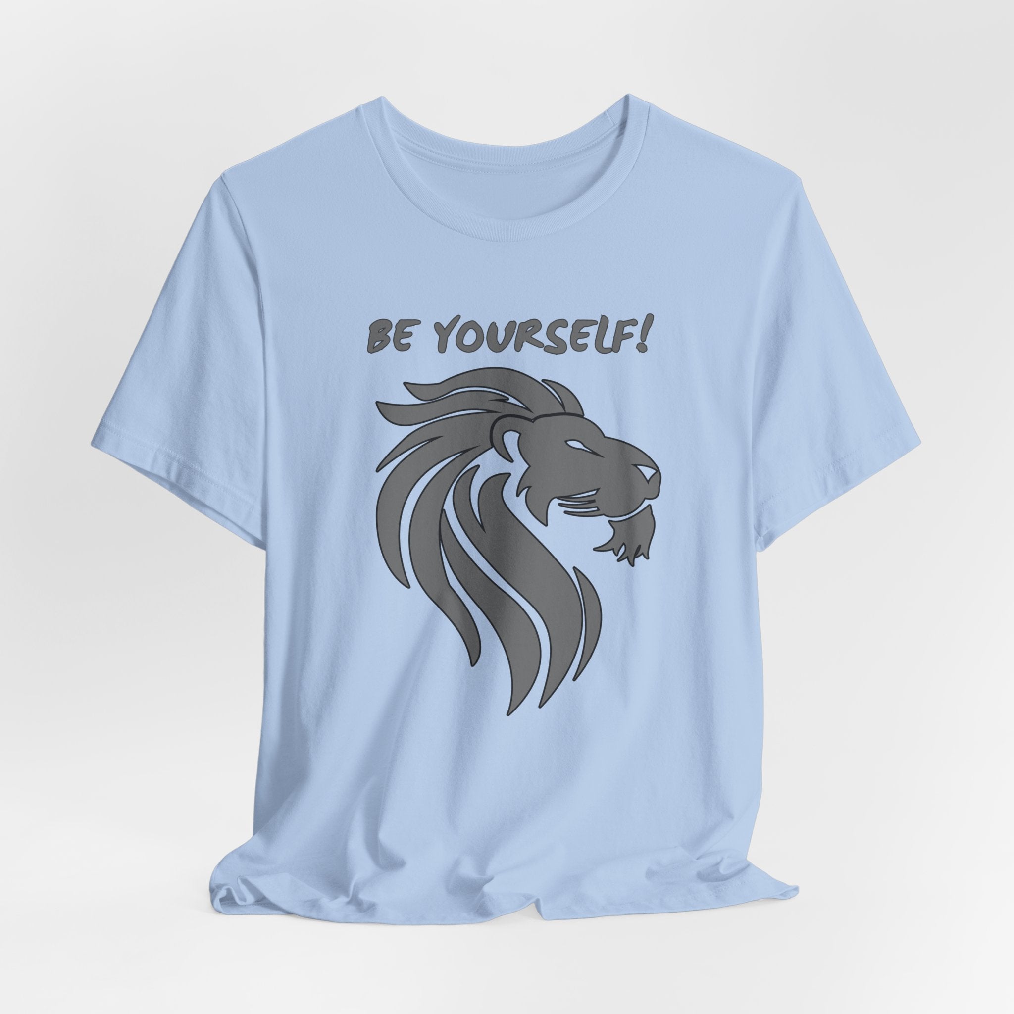 Baby light blue t-shirt with a lion graphic and 'Be Yourself!' text on a light gray background