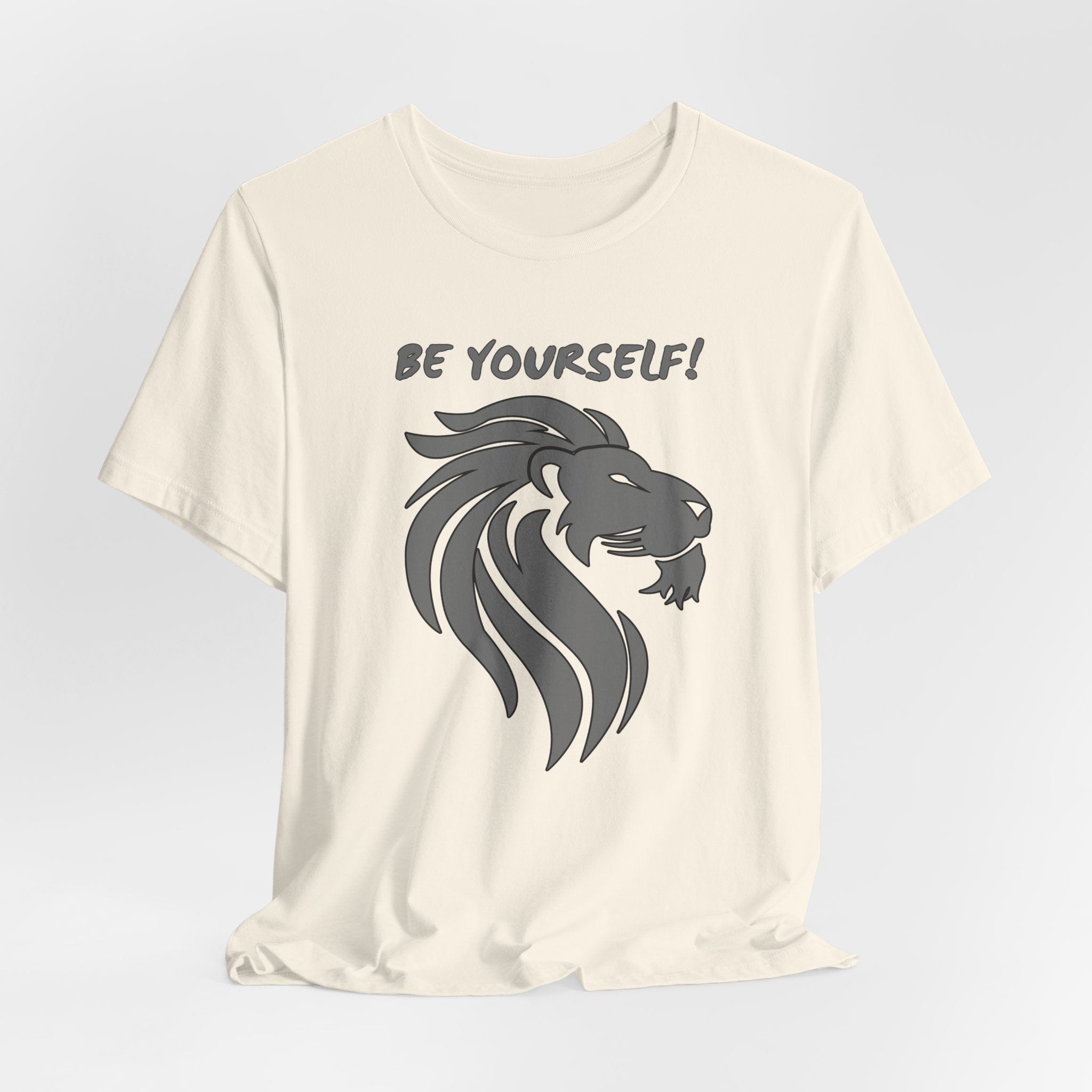 Ivory Beige t-shirt with a lion graphic and 'Be Yourself!' text on a light gray background