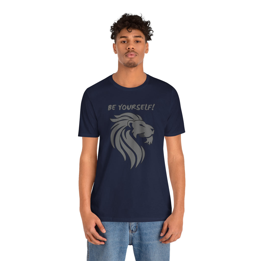 Person wearing a navy blue t-shirt with a lion graphic and 'Be Yourself!' text on a white background