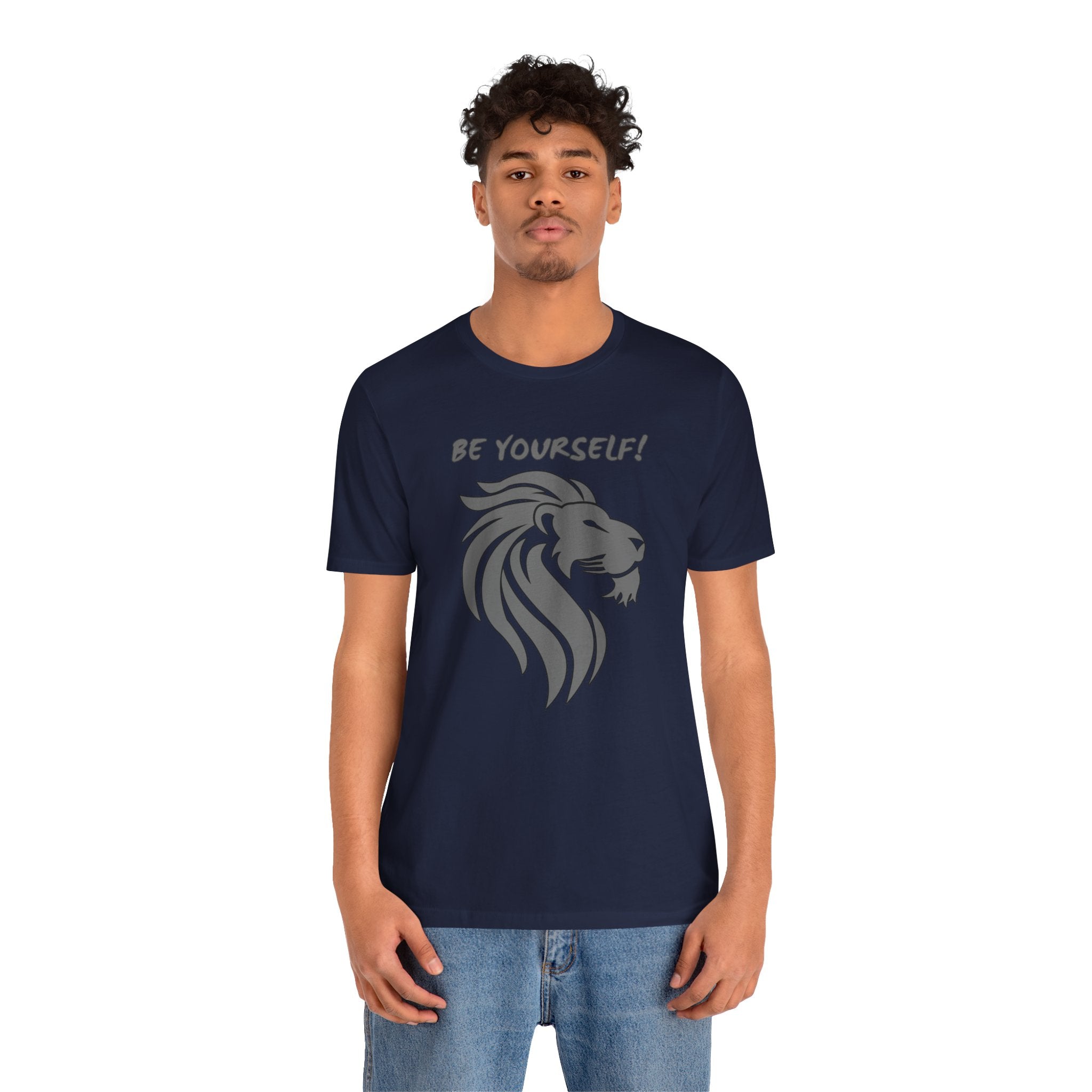 Person wearing a navy blue t-shirt with a lion graphic and 'Be Yourself!' text on a white background