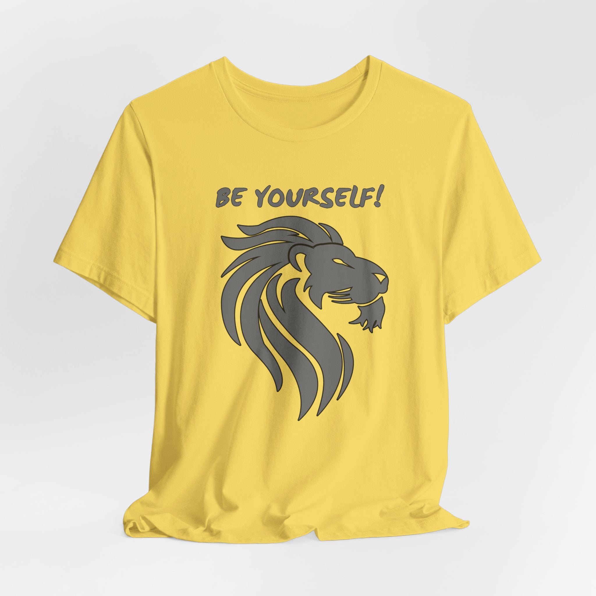 Maze yellow t-shirt with a lion graphic and 'BE YOURSELF!' text on a light gray background
