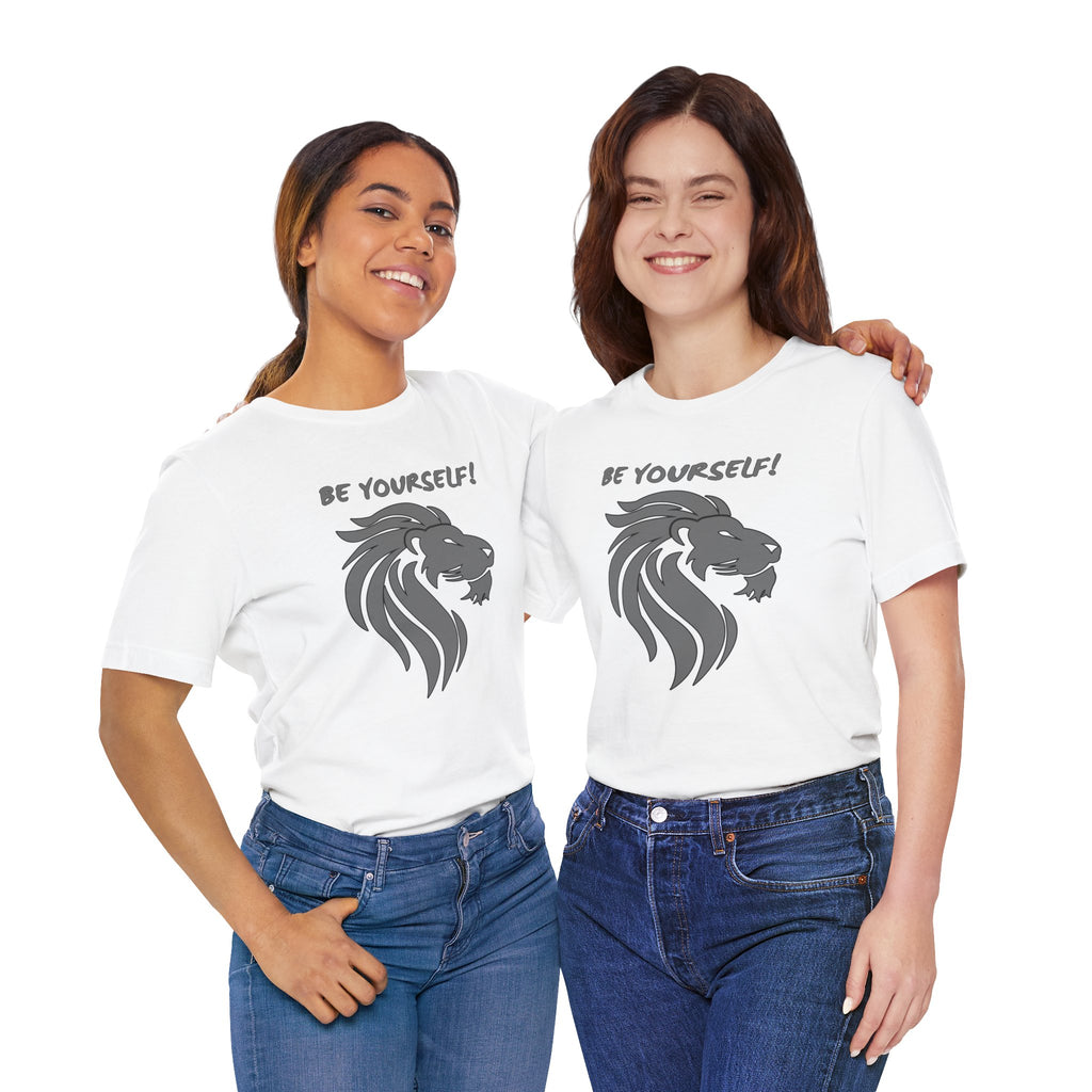 Two people wearing white t-shirts with a lion graphic and 'BE YOURSELF!' text on a white background.