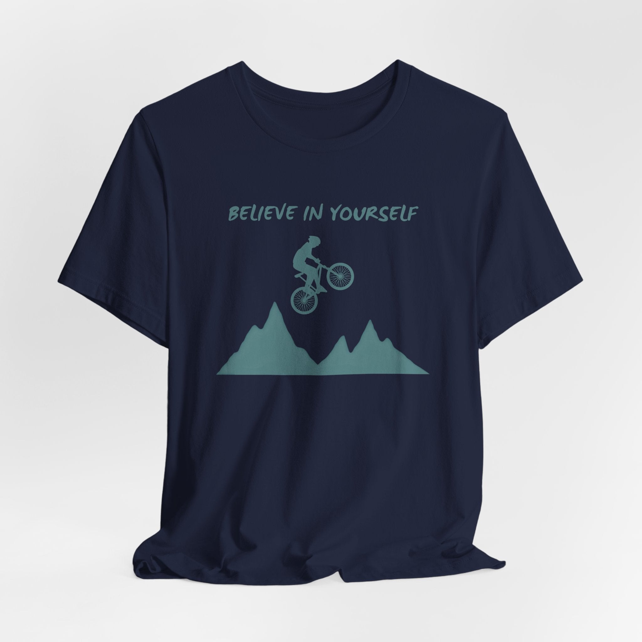 Navy blue t-shirt with mountain bike graphic and 'Believe in Yourself' text on a white background