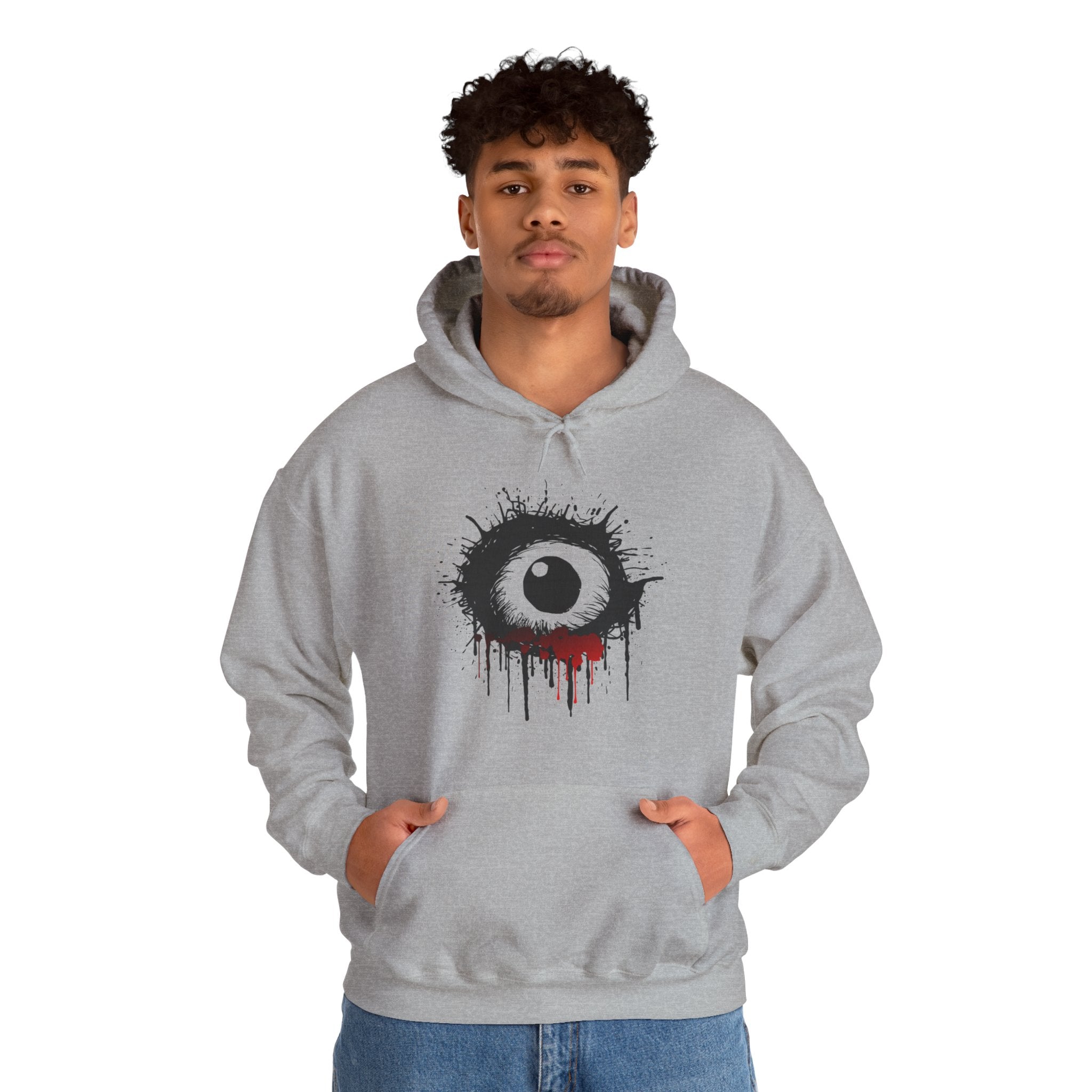 Person wearing a gray hoodie with a unique design on a white background