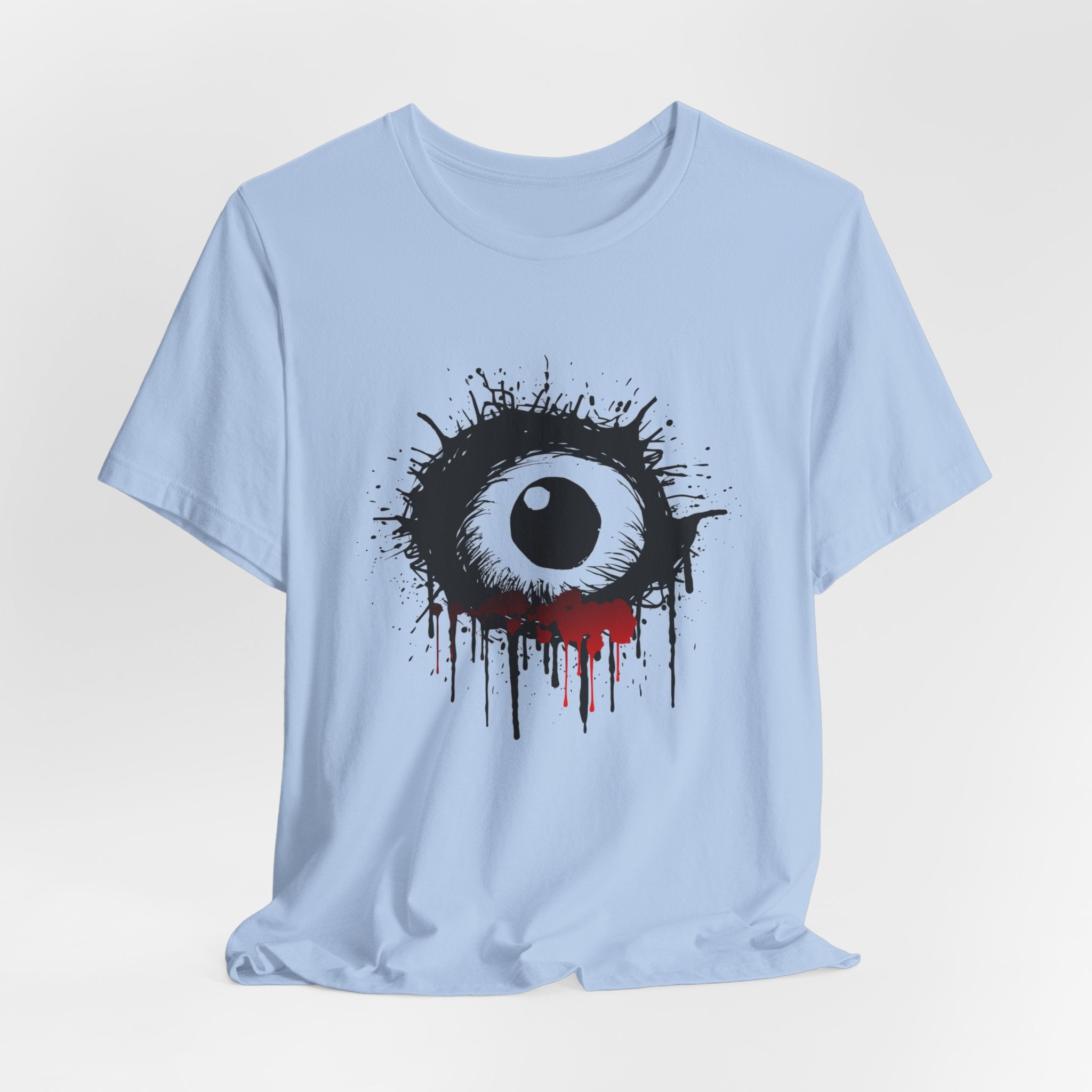 Light blue t-shirt with a black and white eye design on a gray background