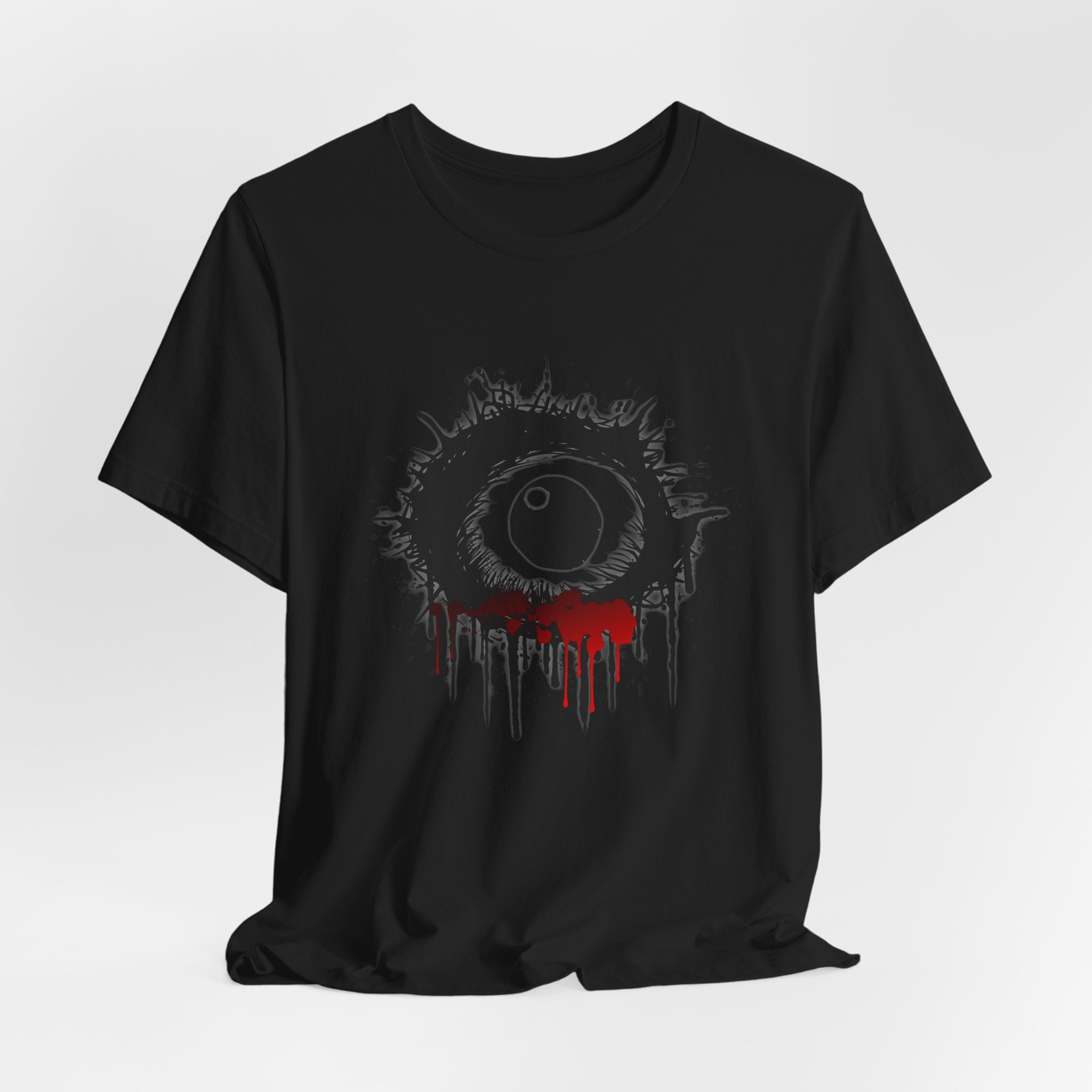 Black t-shirt with a graphic design of an eye with red accents on a white background