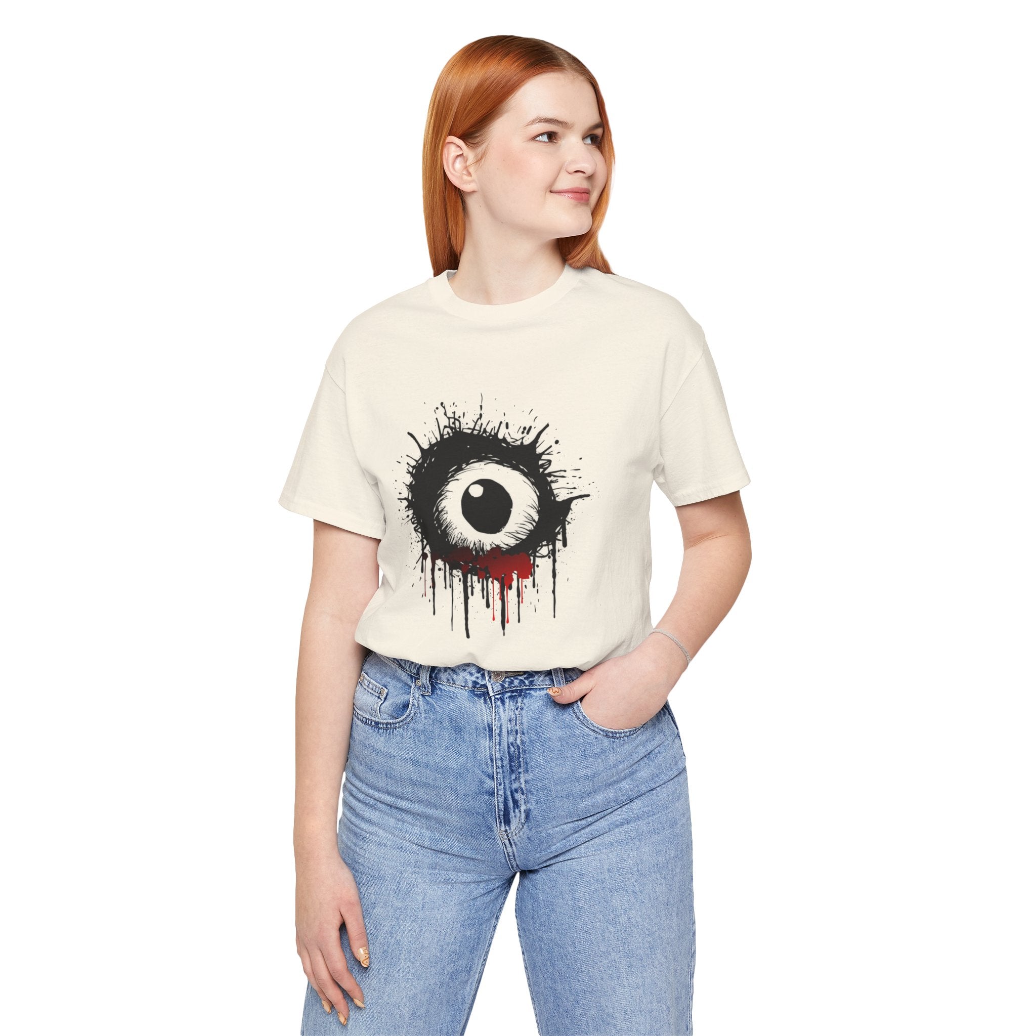 Person wearing a white t-shirt with a black eye design on a white background