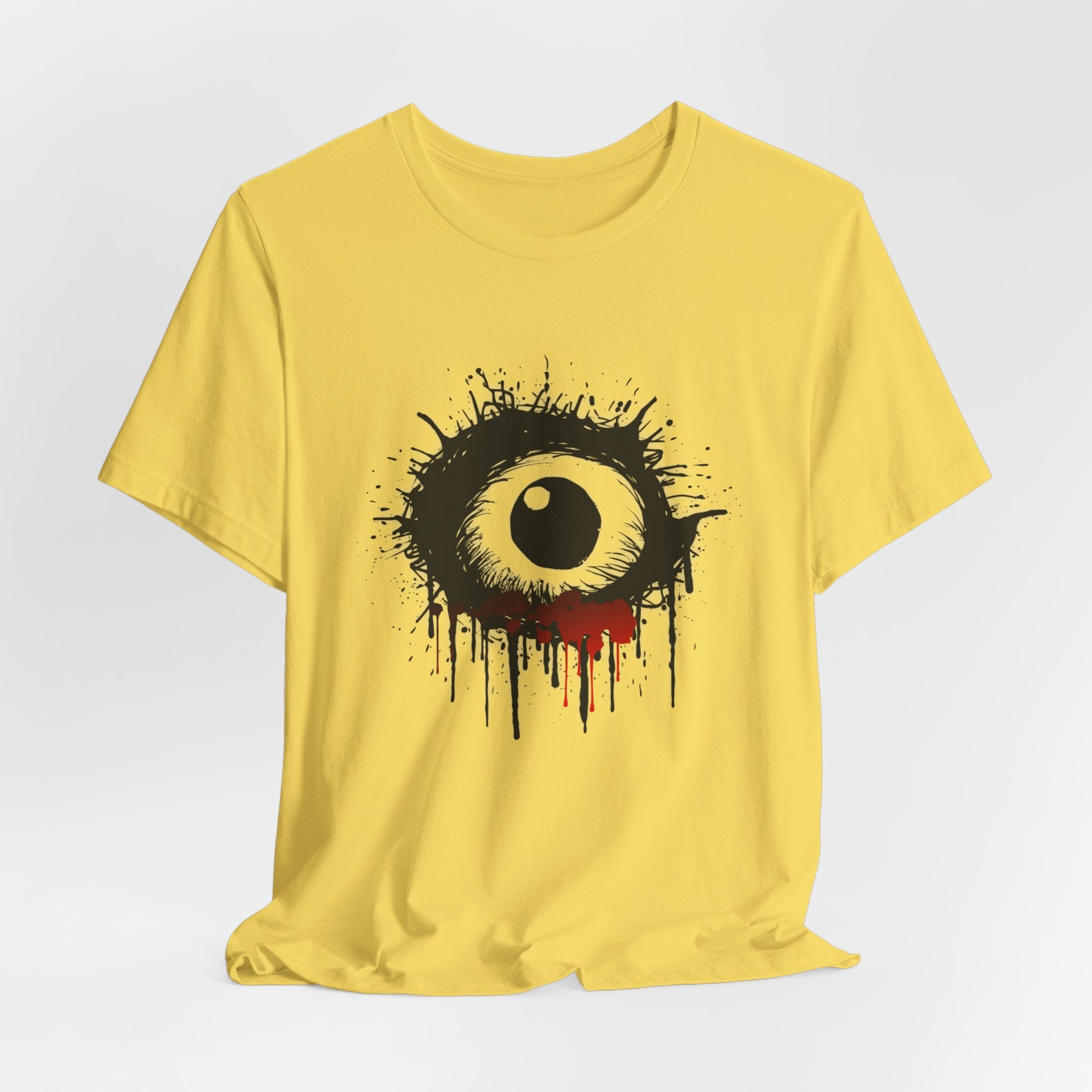Maze yellow t-shirt with a black eye graphic on a white background