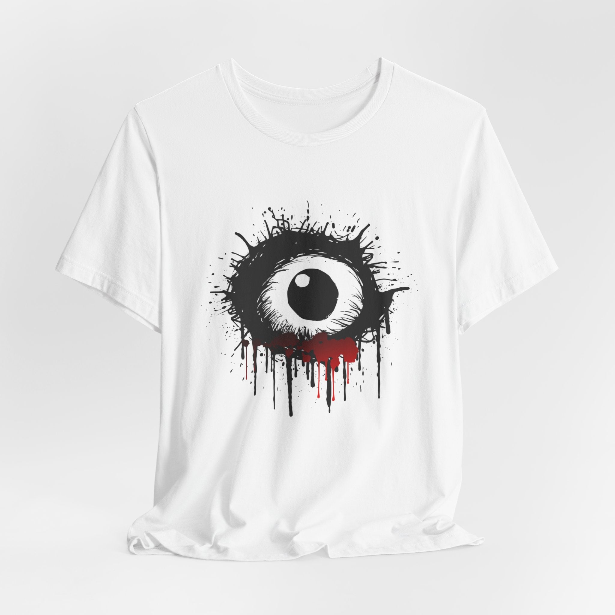 White t-shirt with a black and white eye design on a gray background