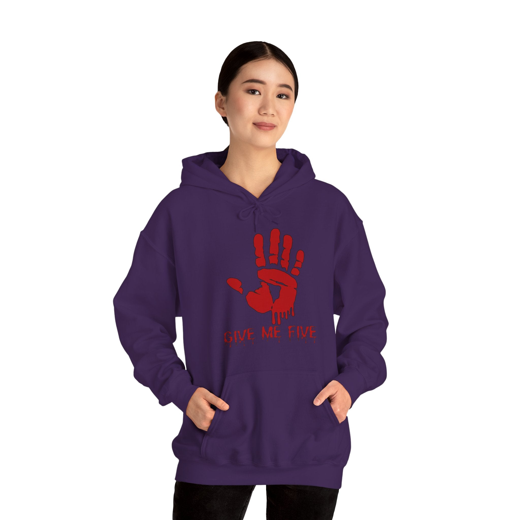 Person wearing a purple hoodie with a red handprint design and text on a white background