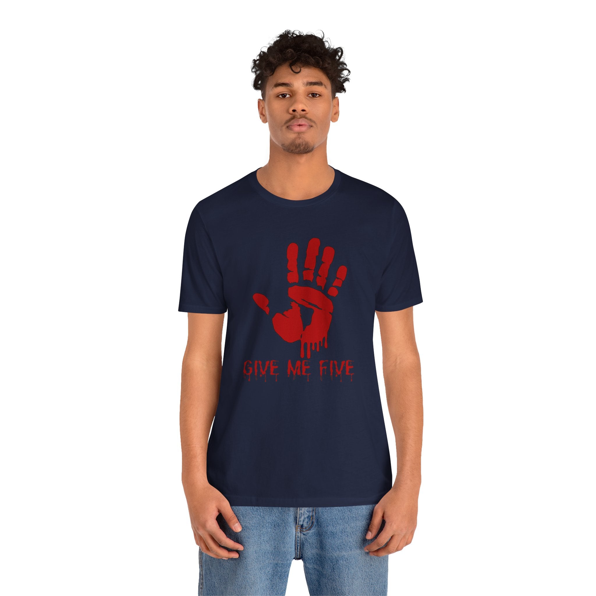 Person wearing a navy blue t-shirt with a red handprint and text on a white background