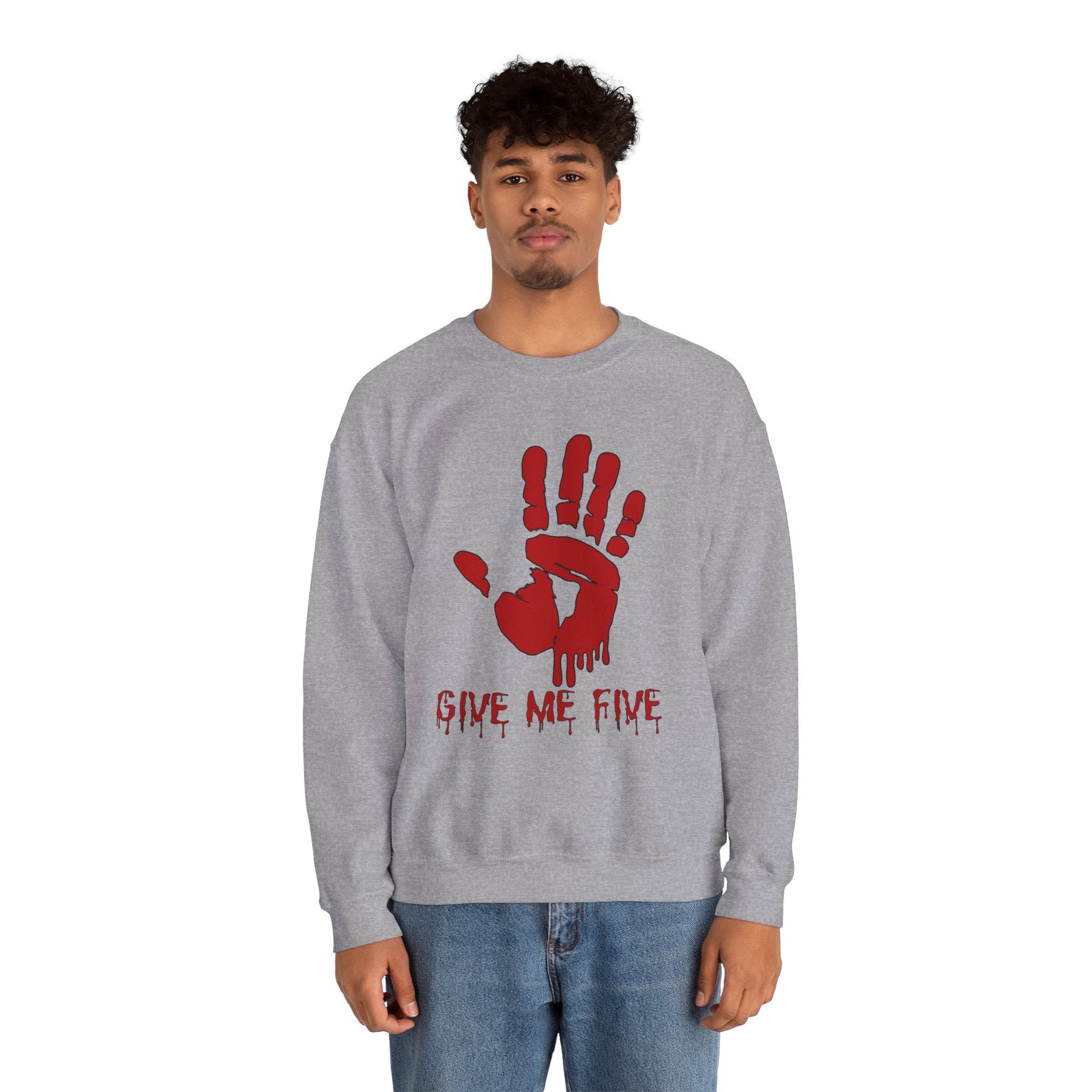 Person wearing a gray sweatshirt with a red handprint design and text on a white background