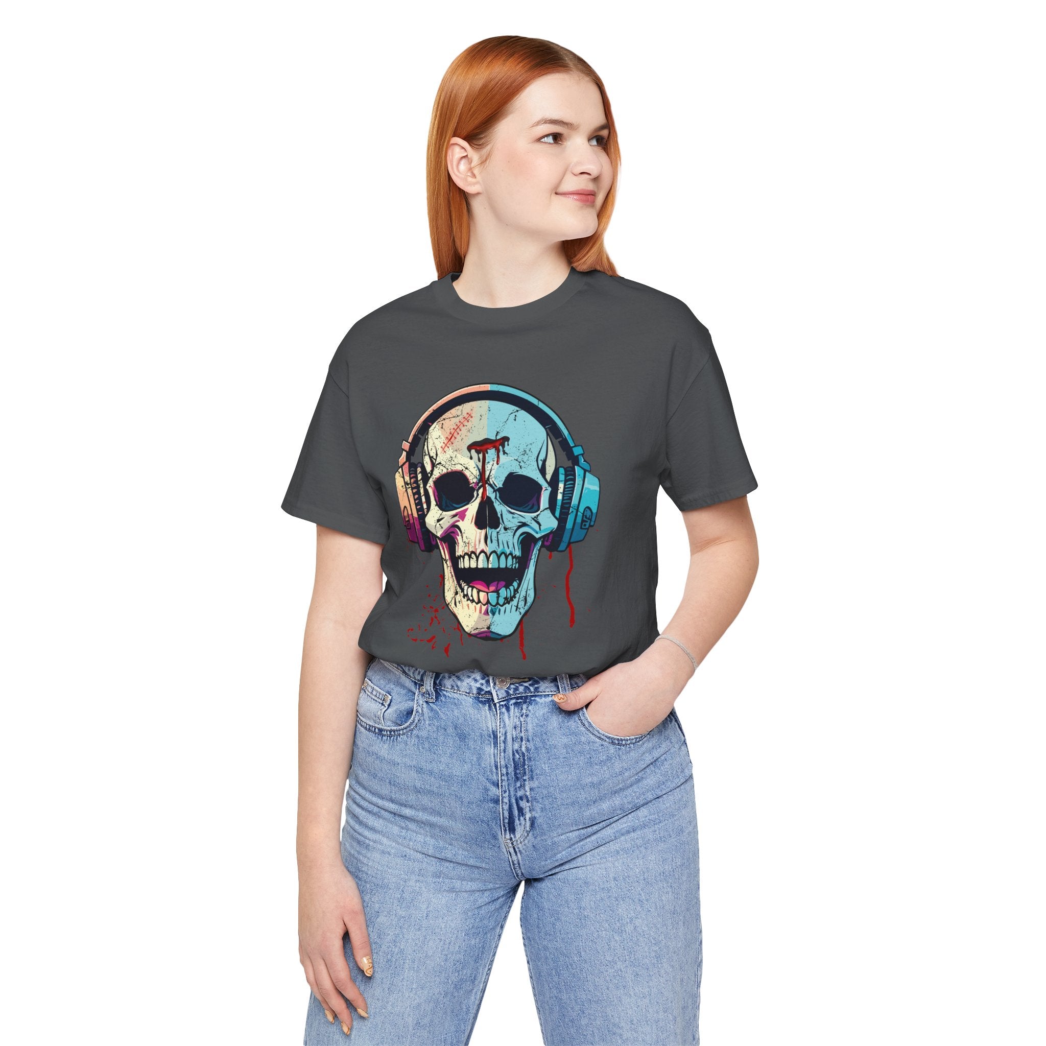 Person wearing a dark gray t-shirt with a colorful skull and headphones design on a white background