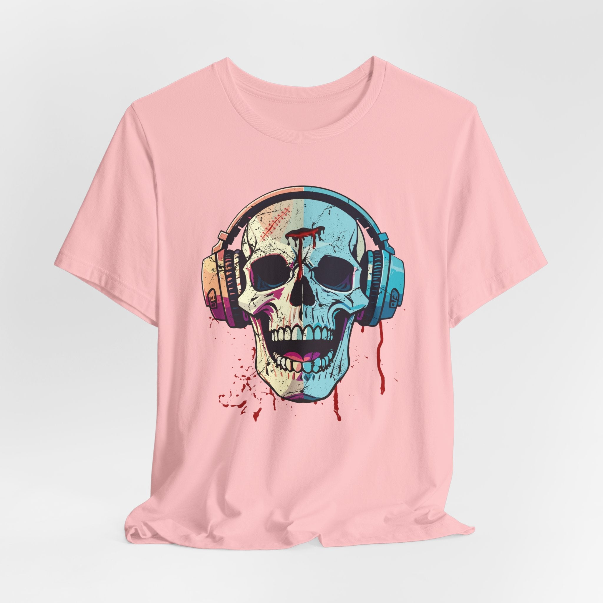 Pink t-shirt with a colorful skull design wearing headphones on a light gray background