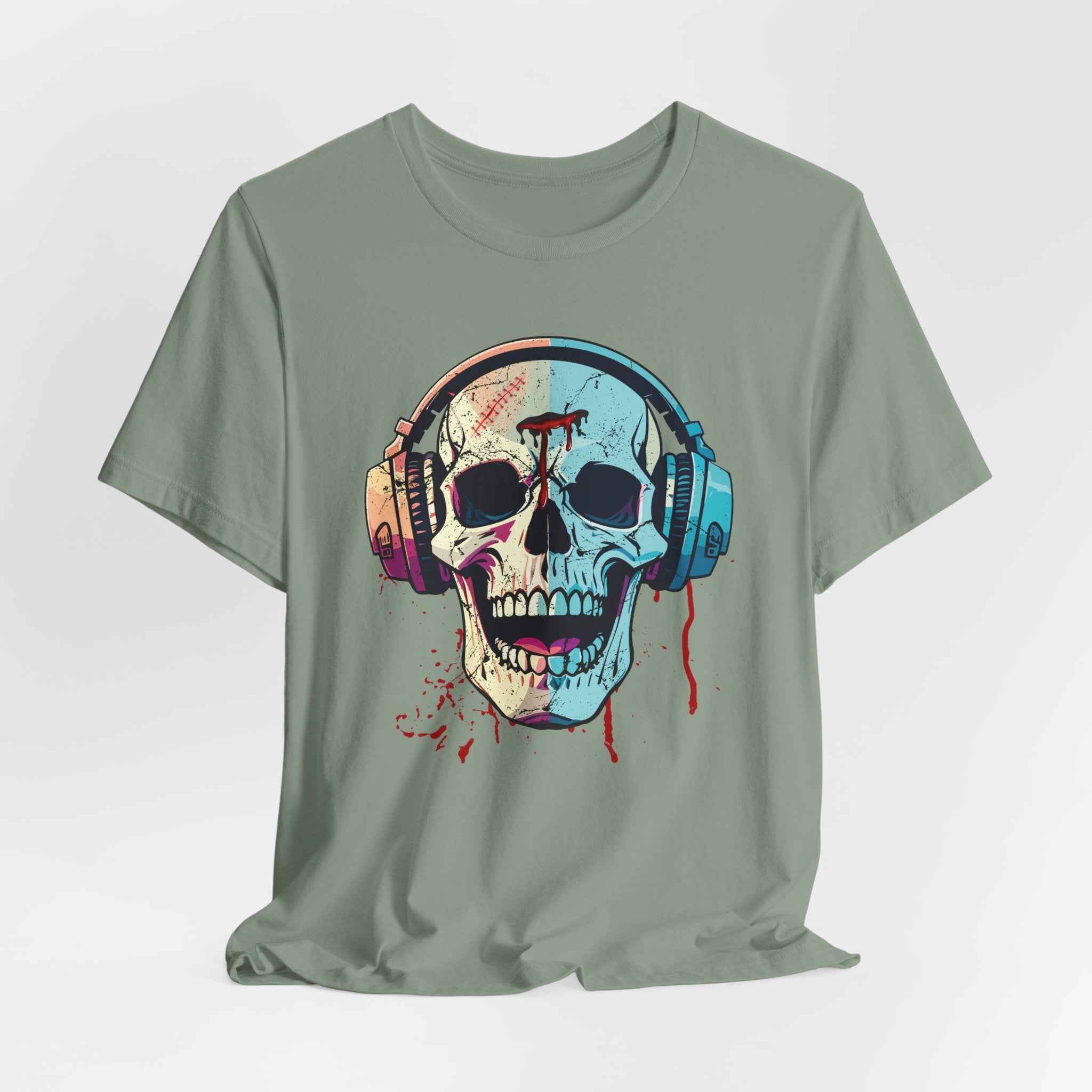 Sage green t-shirt with a colorful skull and headphones design on a light gray background