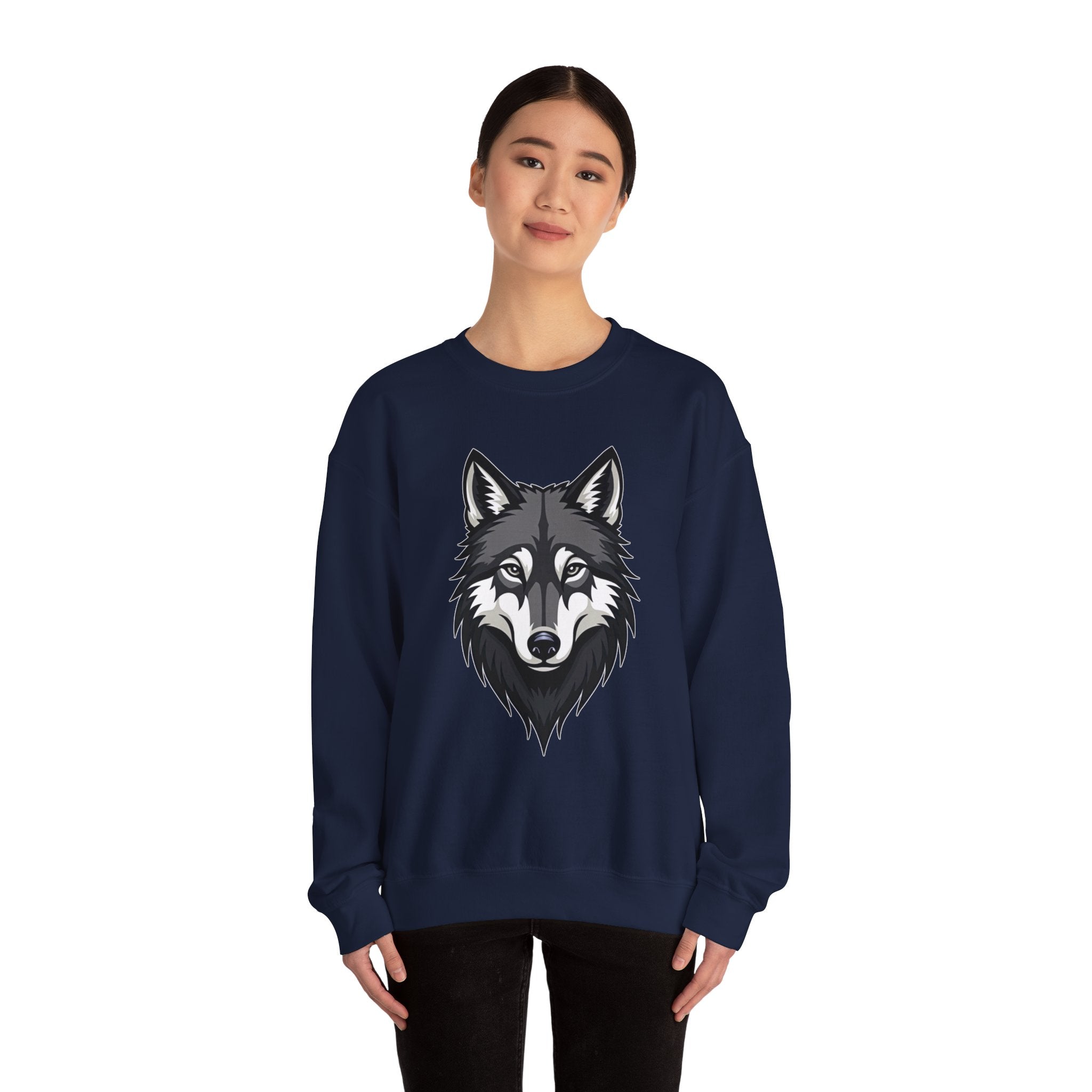 Person wearing a navy blue sweatshirt with a wolf design on a white background