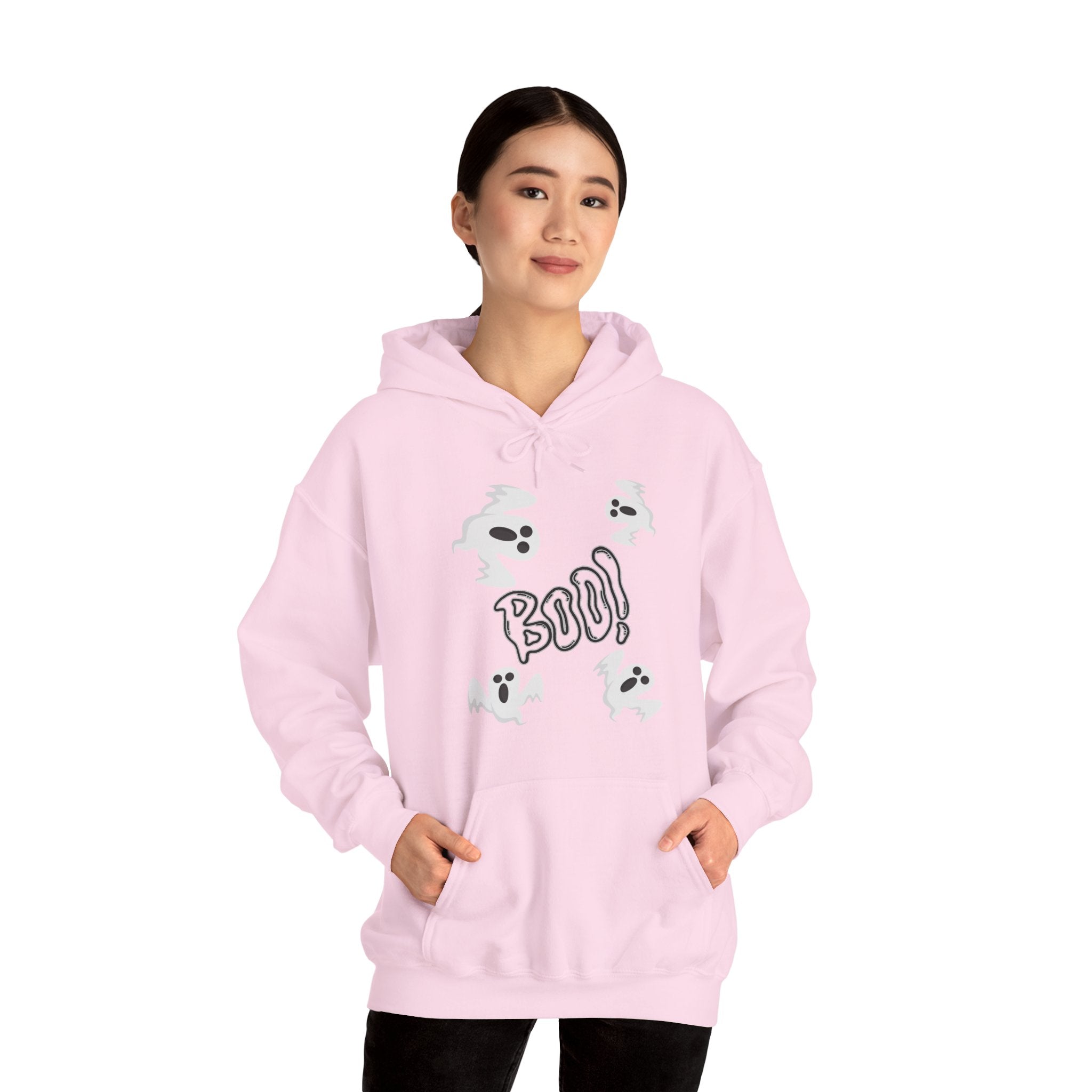 Person wearing a pink hoodie with cartoon designs and text on a white background