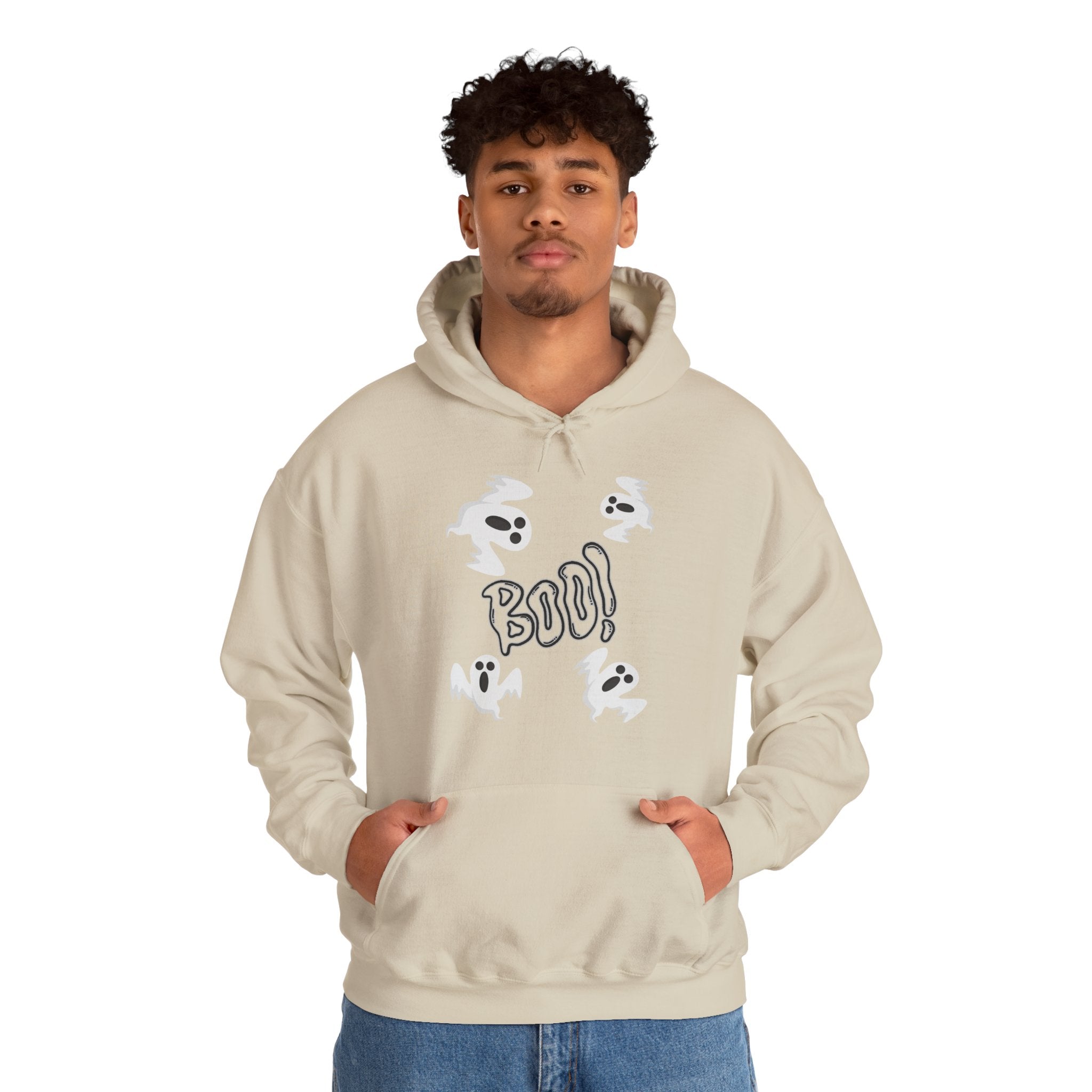 Person wearing a beige hoodie with ghost and 'BOO!' design on a white background