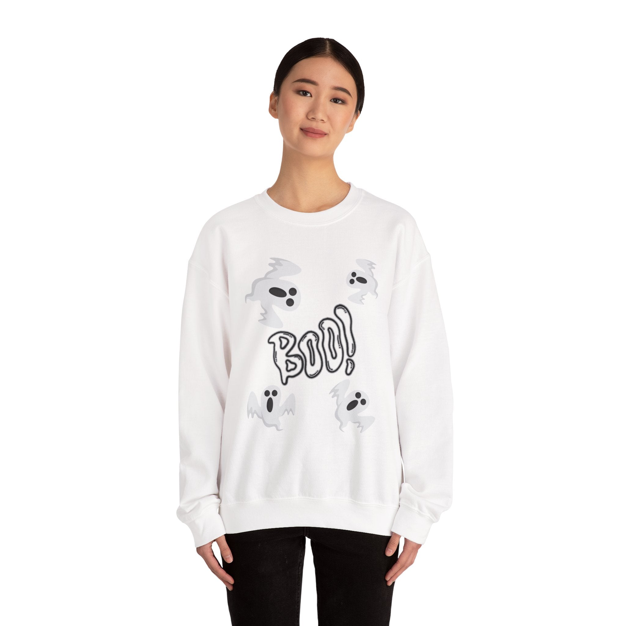 Person wearing a white sweatshirt with a ghost and 'BOO!' design on a white background