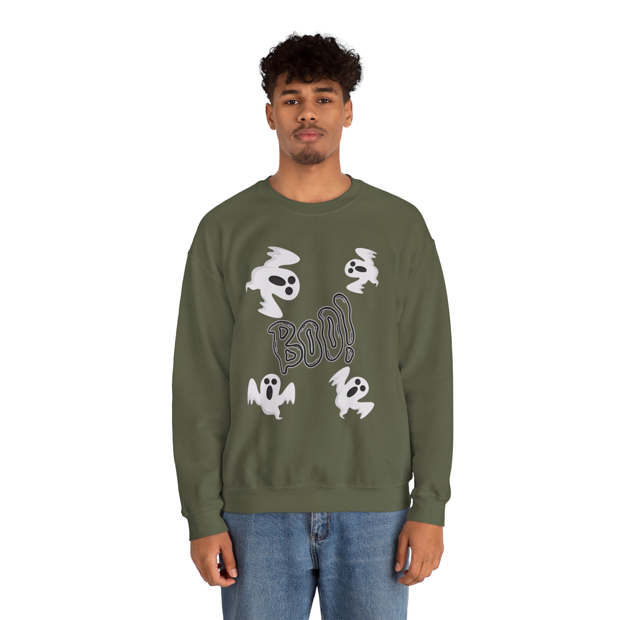 Person wearing a green sweatshirt with ghost and 'BOO!' design on a white background