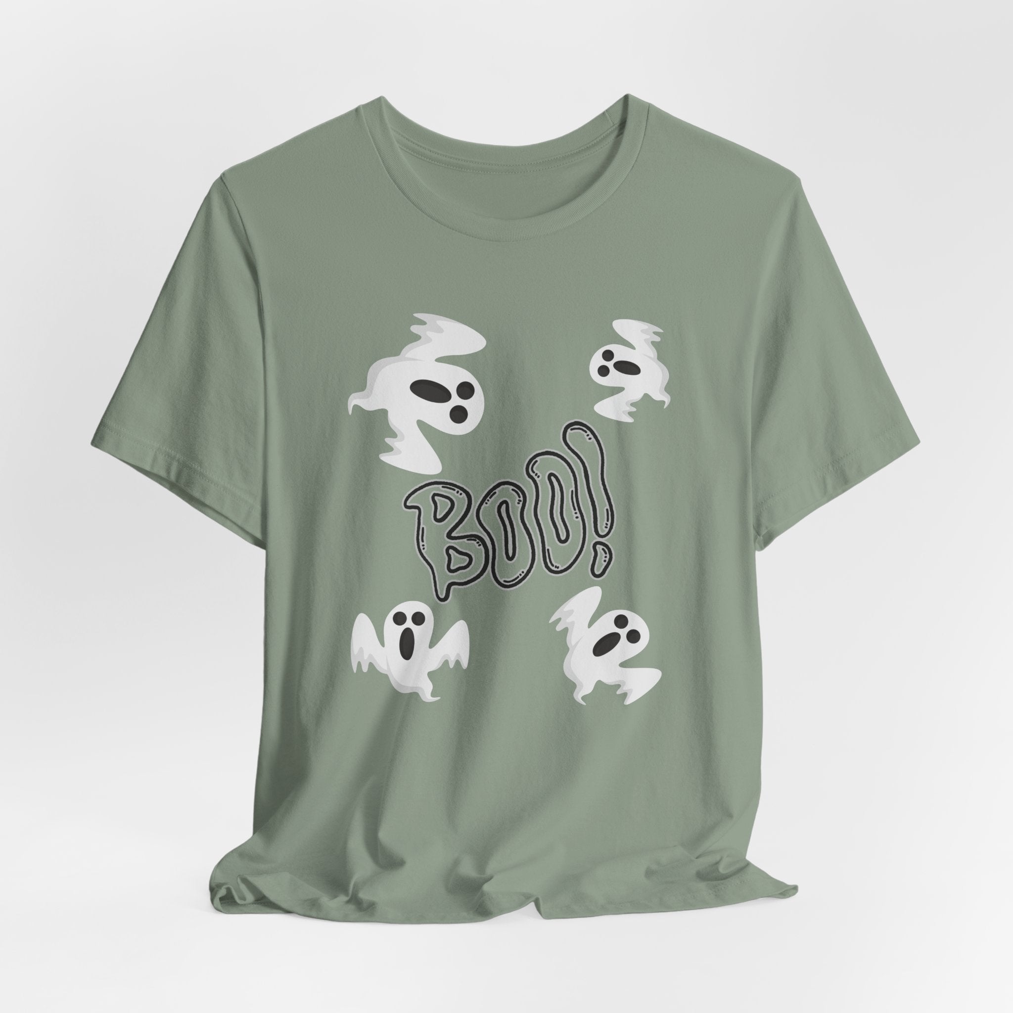 Sage green t-shirt with ghost illustrations and 'BOO!' text on a light gray background