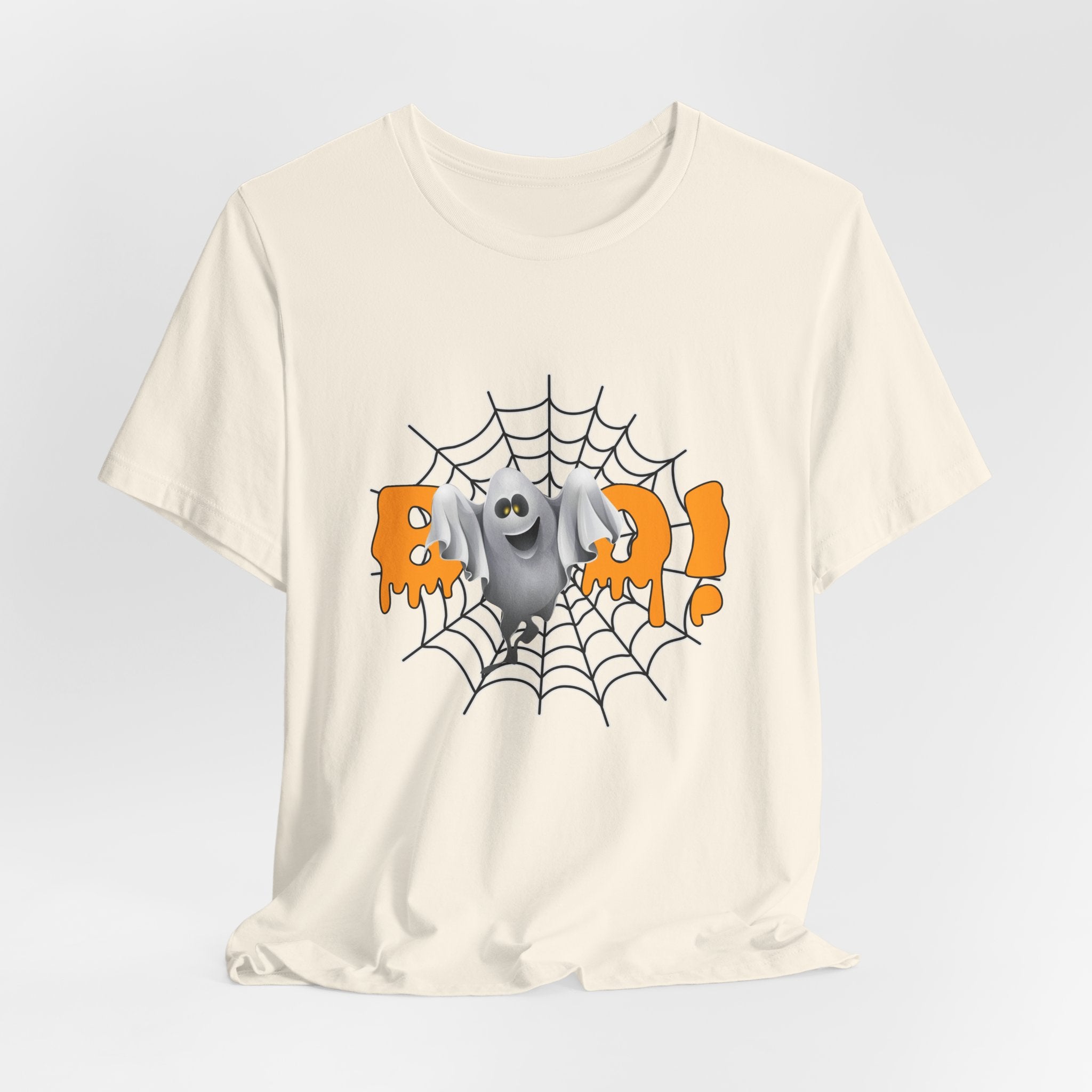 Ivory beige t-shirt with a Halloween-themed graphic of a ghost on a spider web.