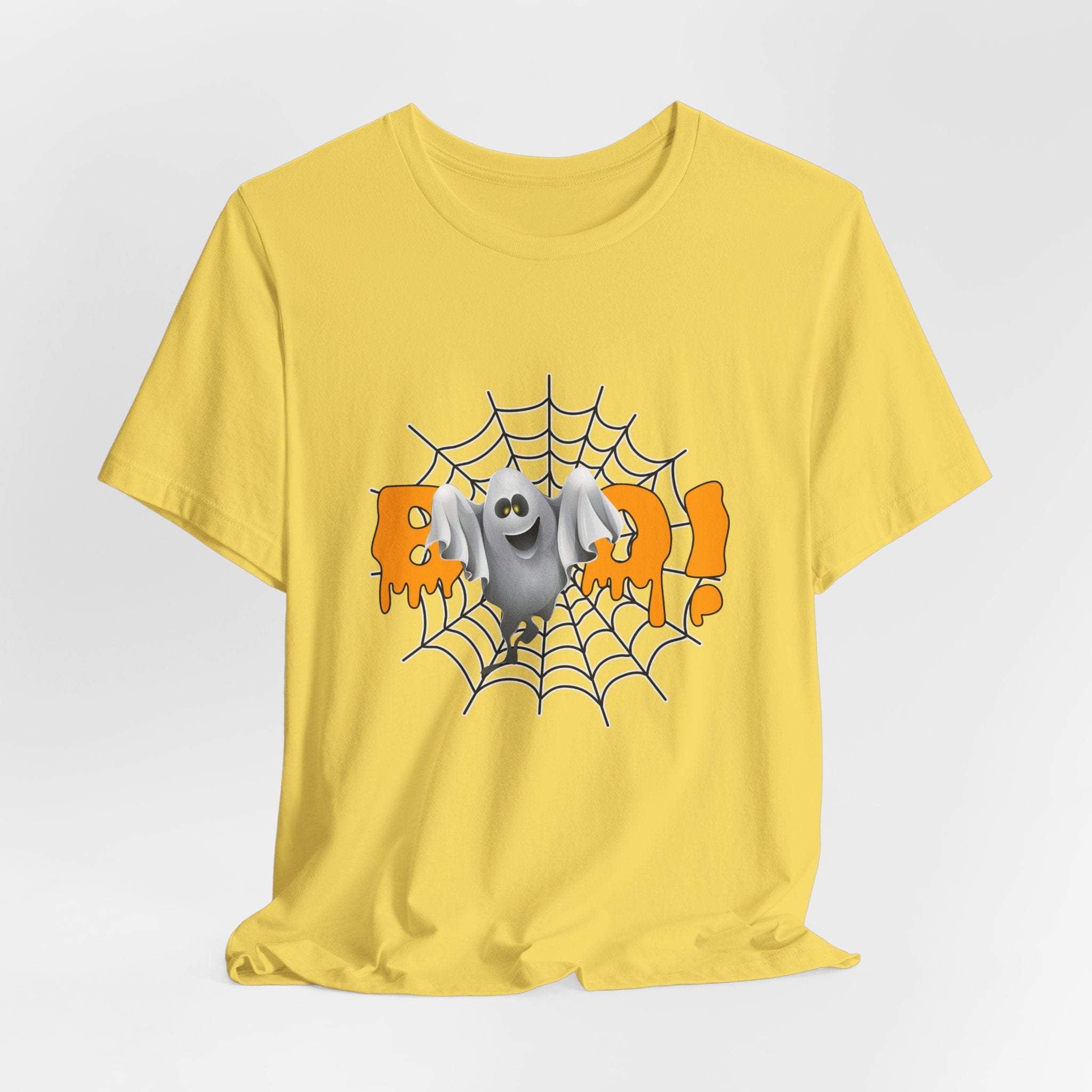 Yellow t-shirt with a Halloween-themed graphic of a bat on a spider web and the word 'BOO!' on a white background.