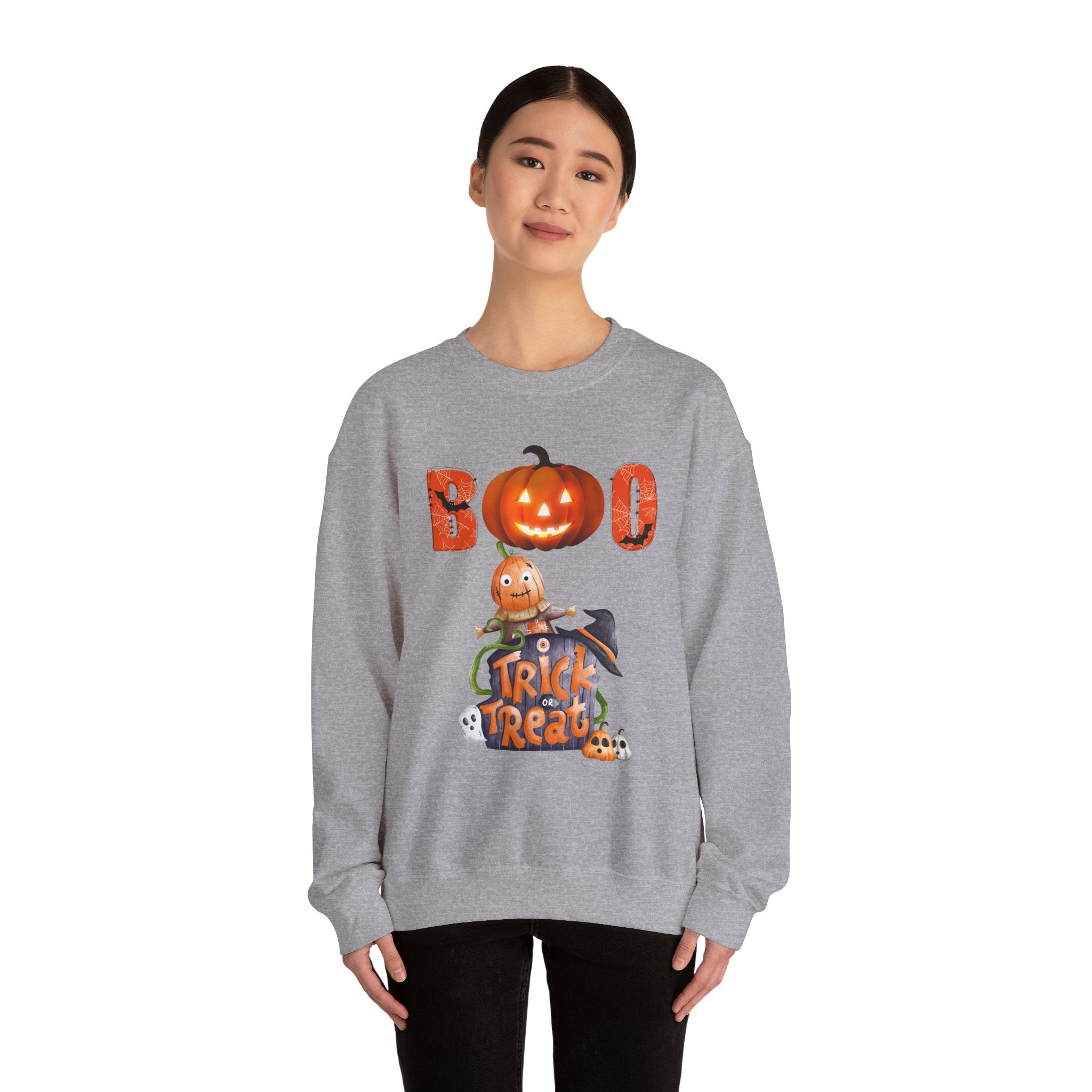 Person wearing a gray sweatshirt with Halloween-themed design on a white background