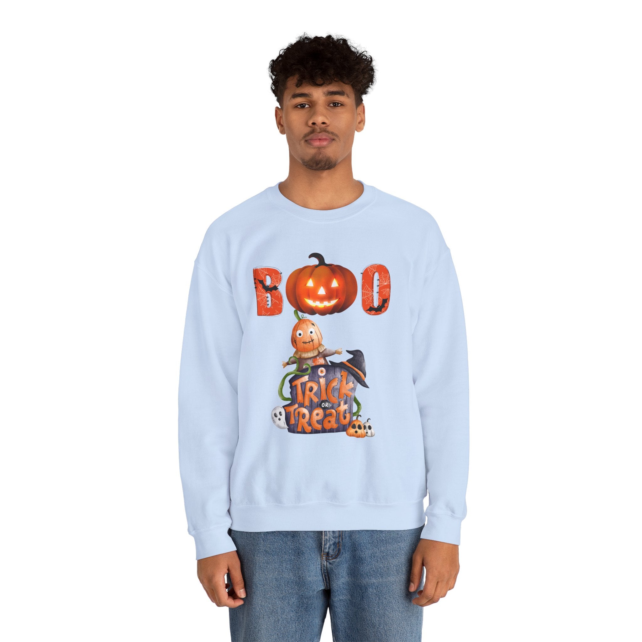Person wearing a light blue sweatshirt with Halloween-themed design on a white background