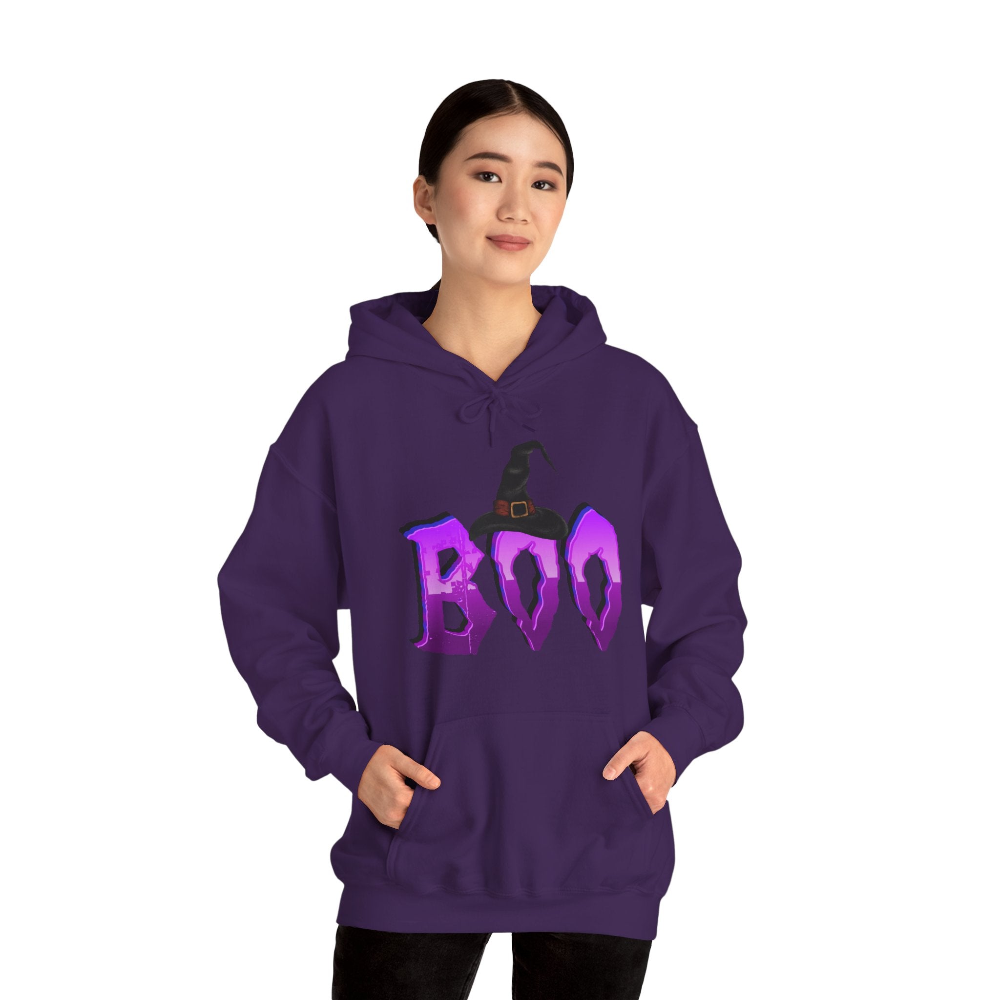 Person wearing a purple hoodie with 'BOO' and witch hat design on a white background