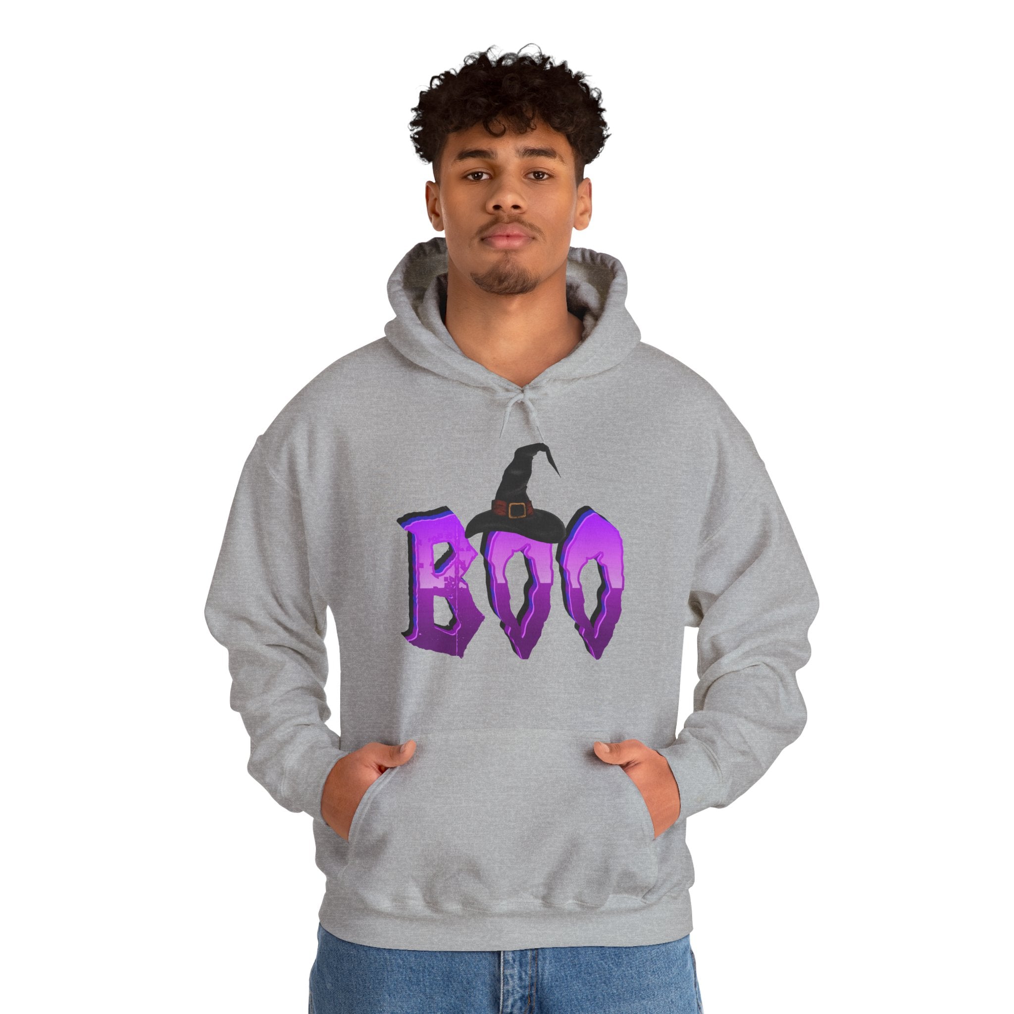 Person wearing a gray hoodie with 'BOO' and a witch hat design on a white background