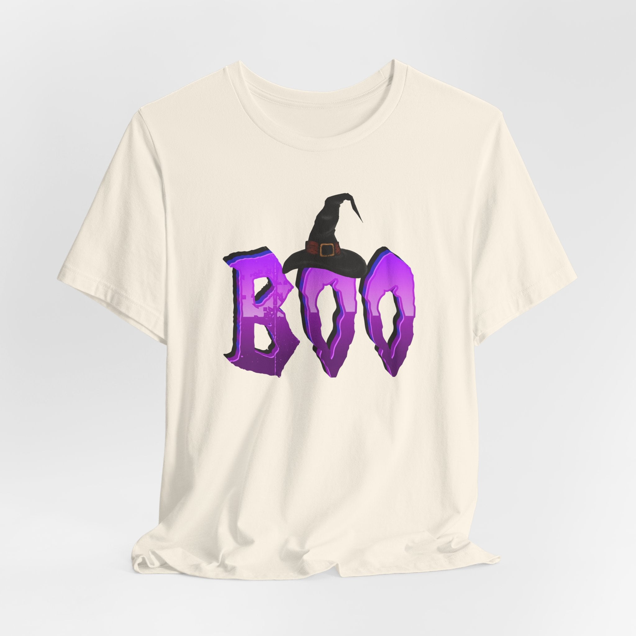 Ivory beige t-shirt with 'BOO' and witch hat graphic on a light gray background