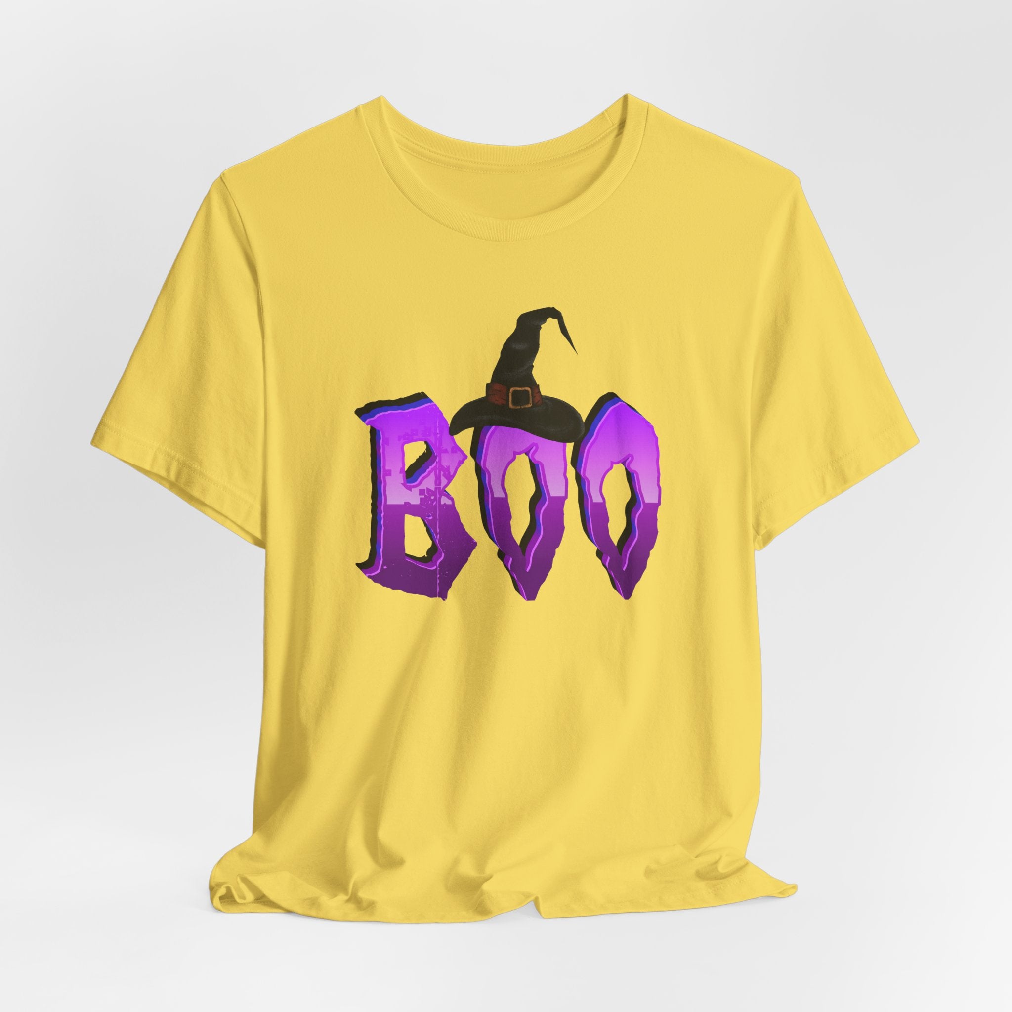 Maze yellow t-shirt with purple 'BOO' text and witch hat design on a light gray background