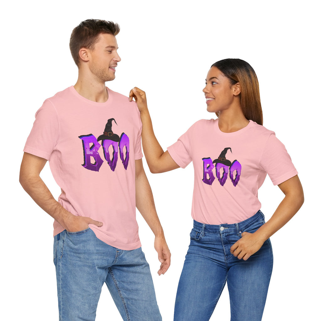 Two people wearing pink t-shirts with 'BOO' and witch hat design on a white background