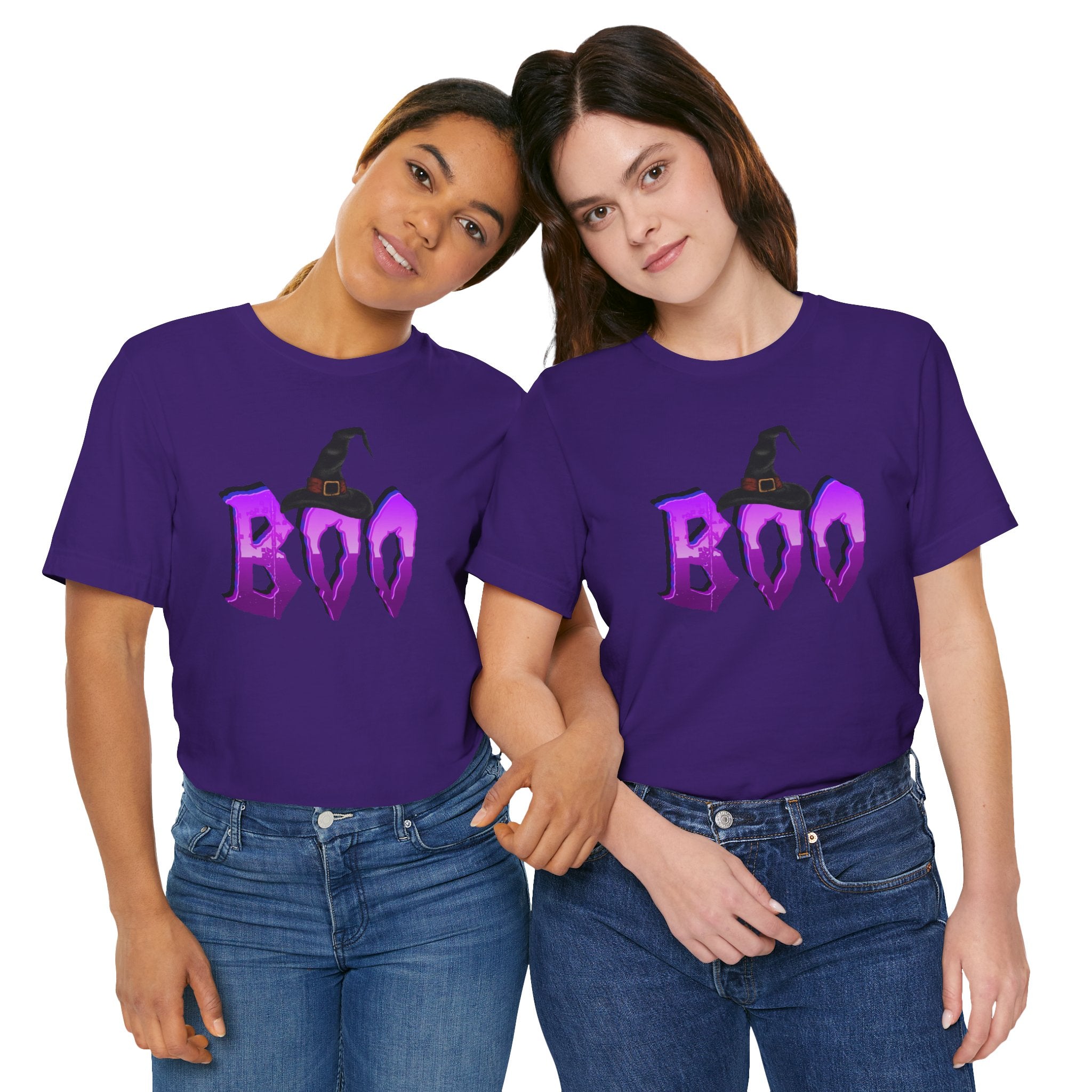 Two people wearing purple t-shirts with 'BOO' and witch hats design.
