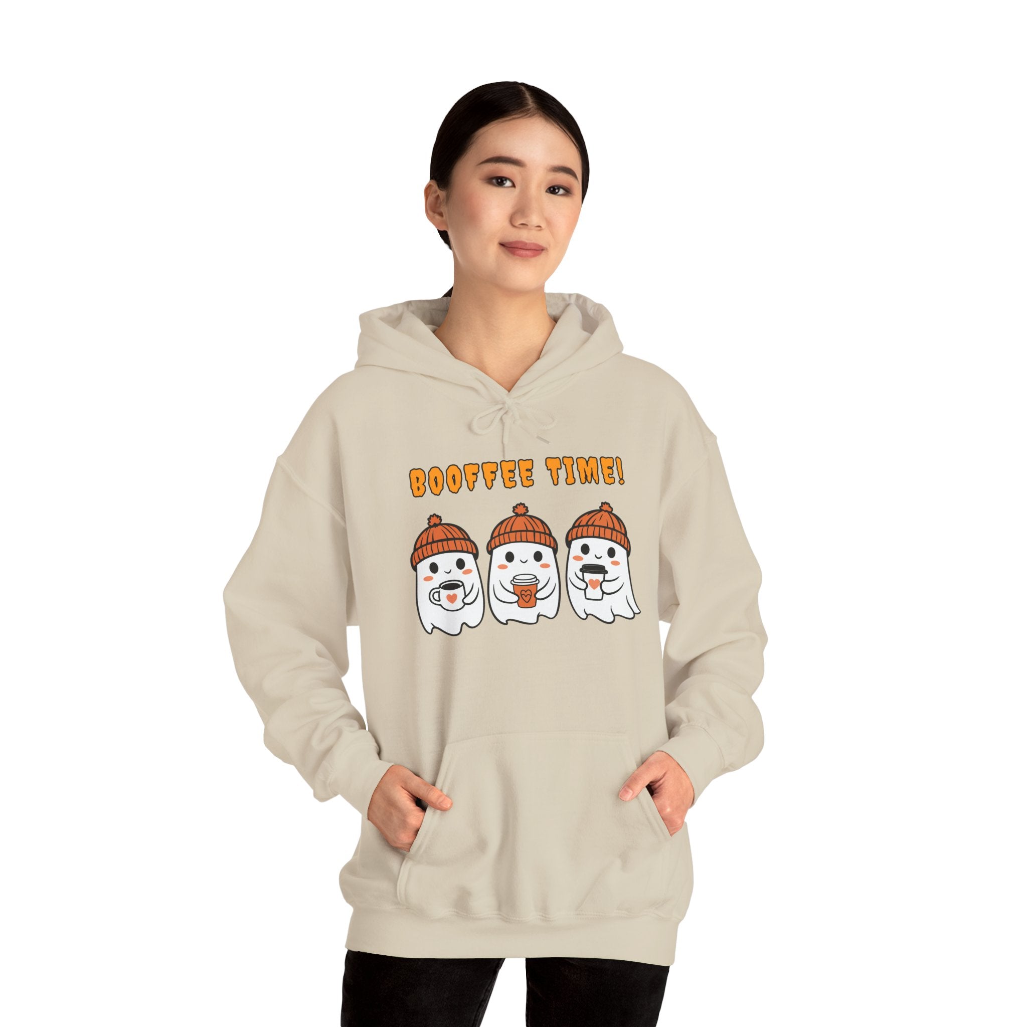 Person wearing a beige hoodie with cartoon snowmen and 'Boo fie Time!' text on a white background