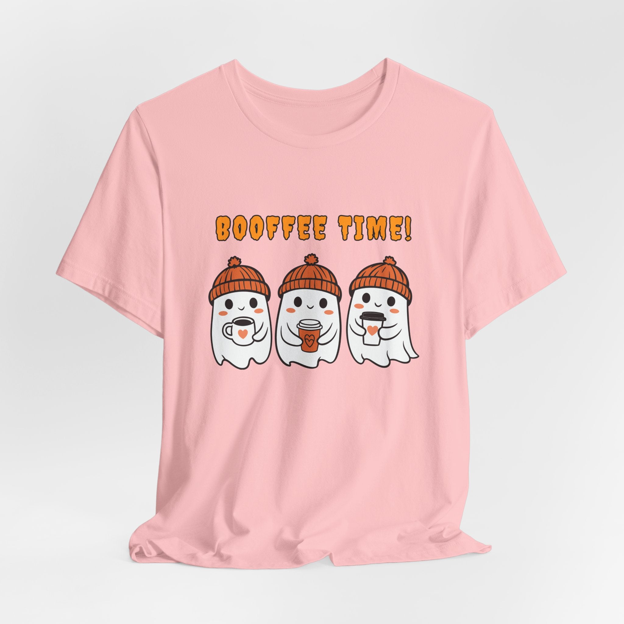 Pink t-shirt with cartoon ghosts and 'Booffee Time!' text on a light gray background