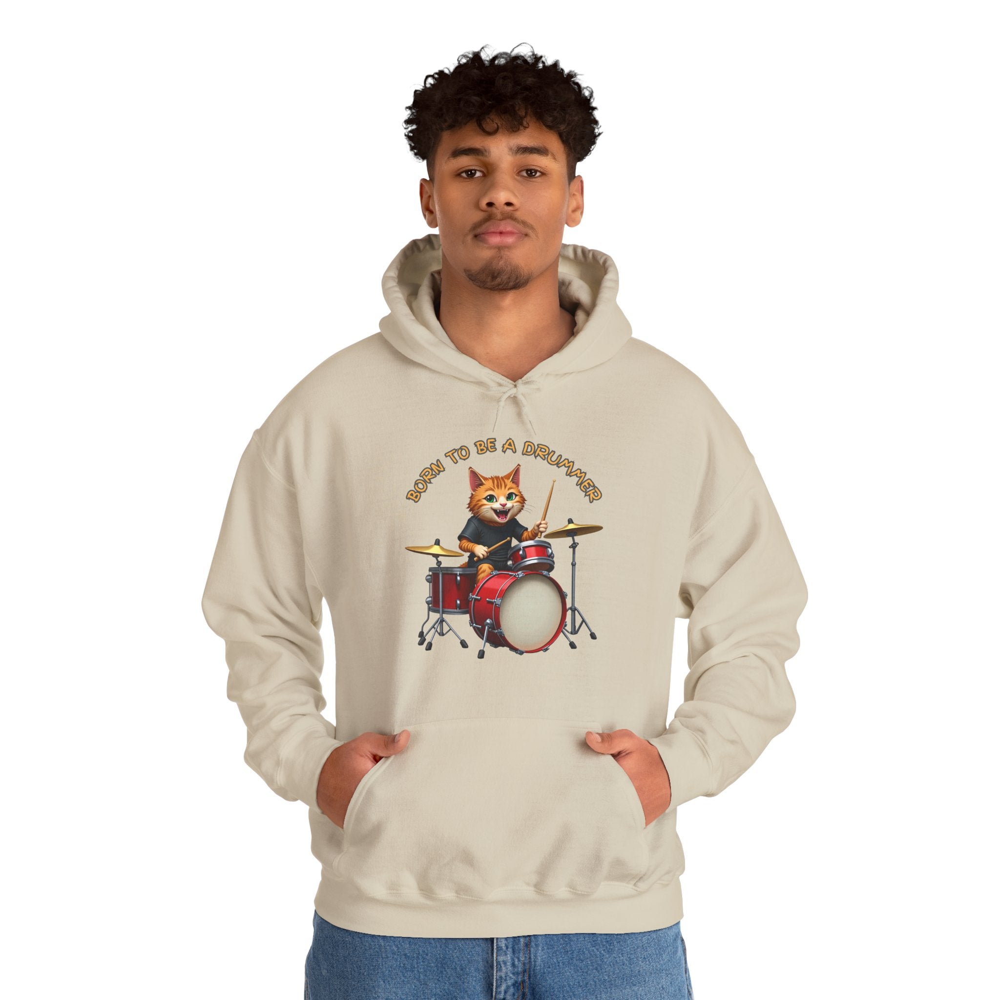 Person wearing a beige hoodie with a cat playing drums graphic on a white background