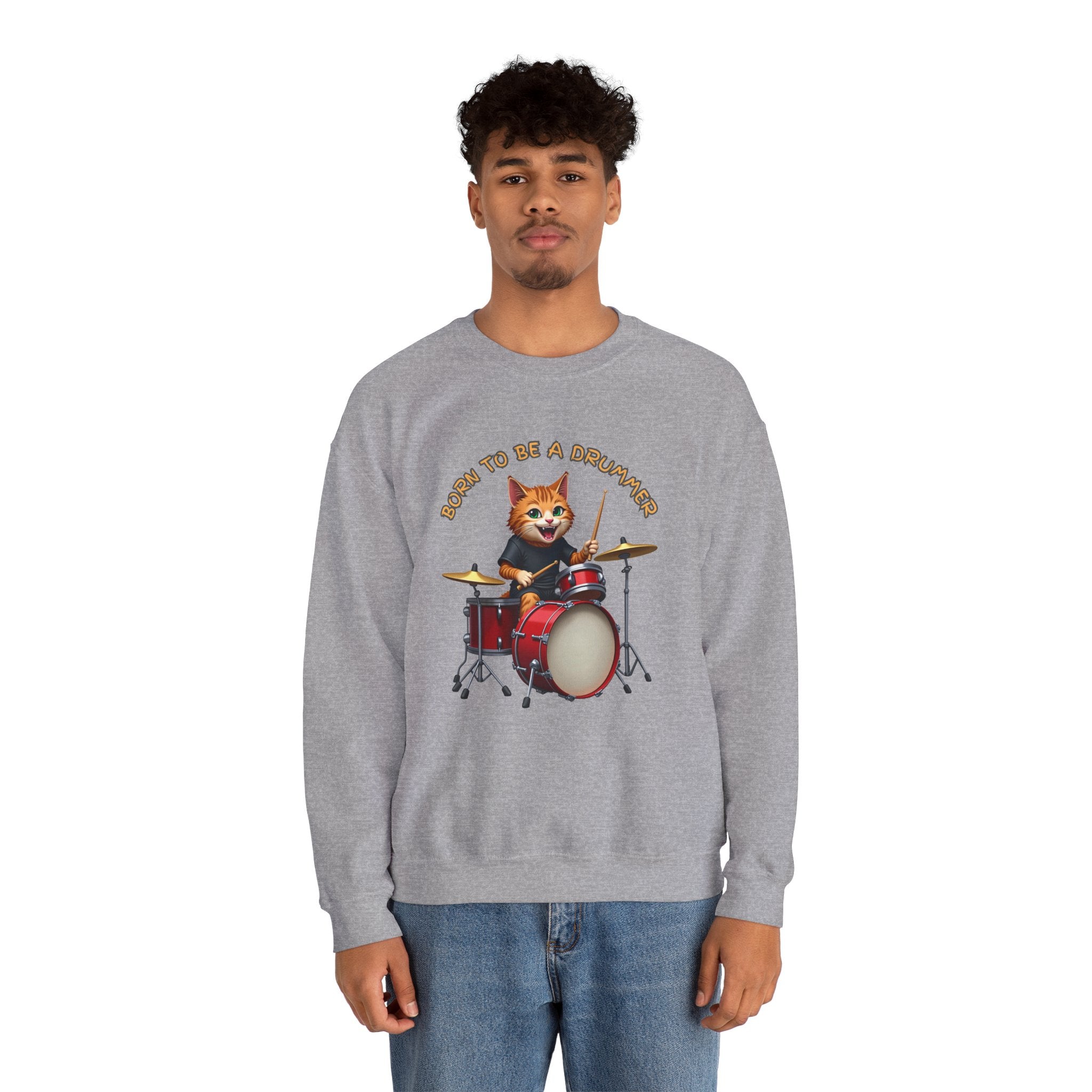 Person wearing a gray sweatshirt with a cat playing drums graphic and text.