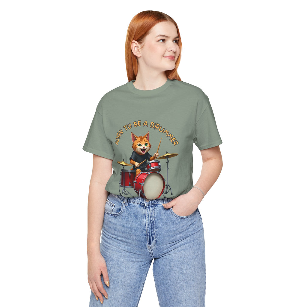 Person wearing a green t-shirt with a cartoon fox playing drums graphic and text.