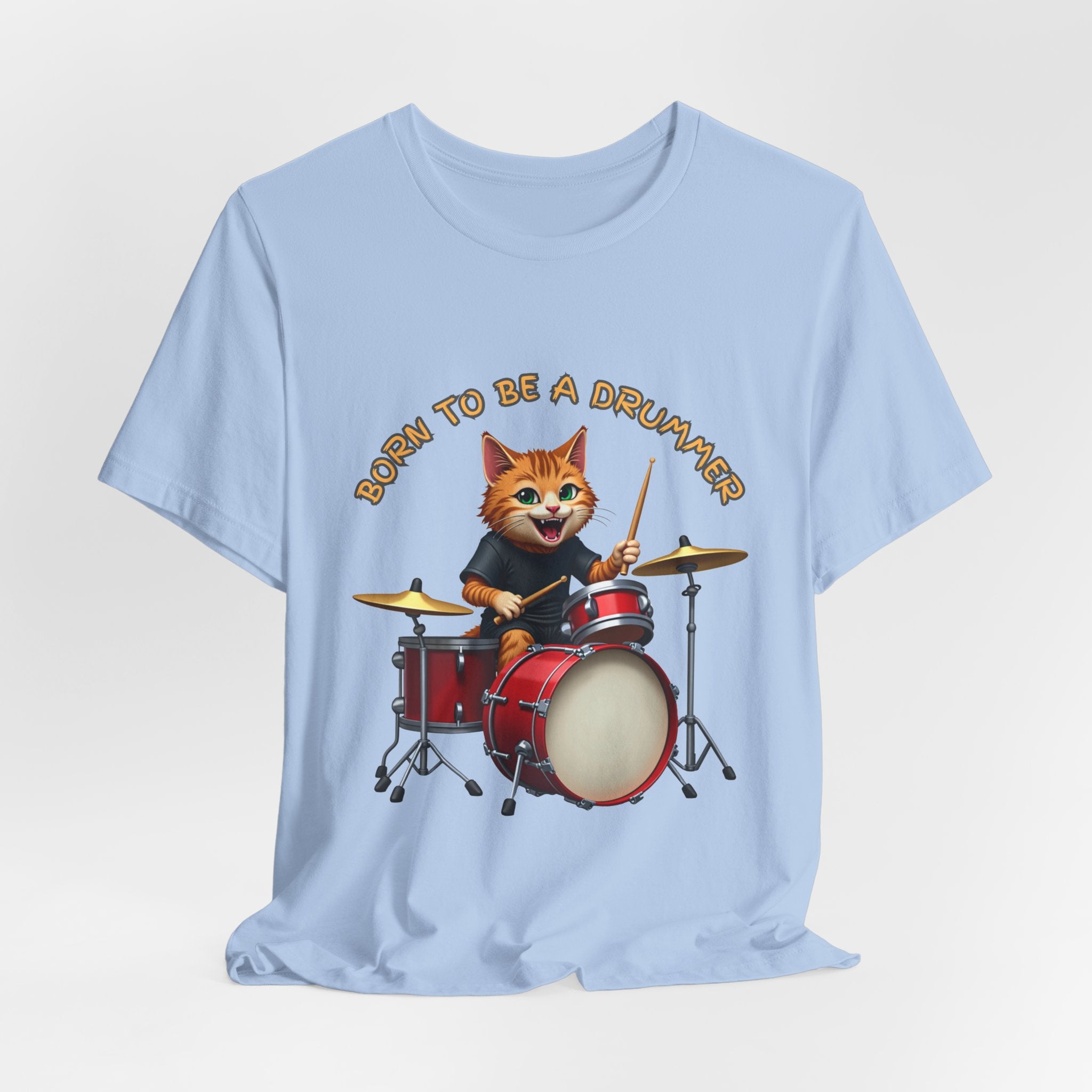 Light blue t-shirt with a cartoon cat playing drums and 'Born to be a Drummer' text on a light gray background
