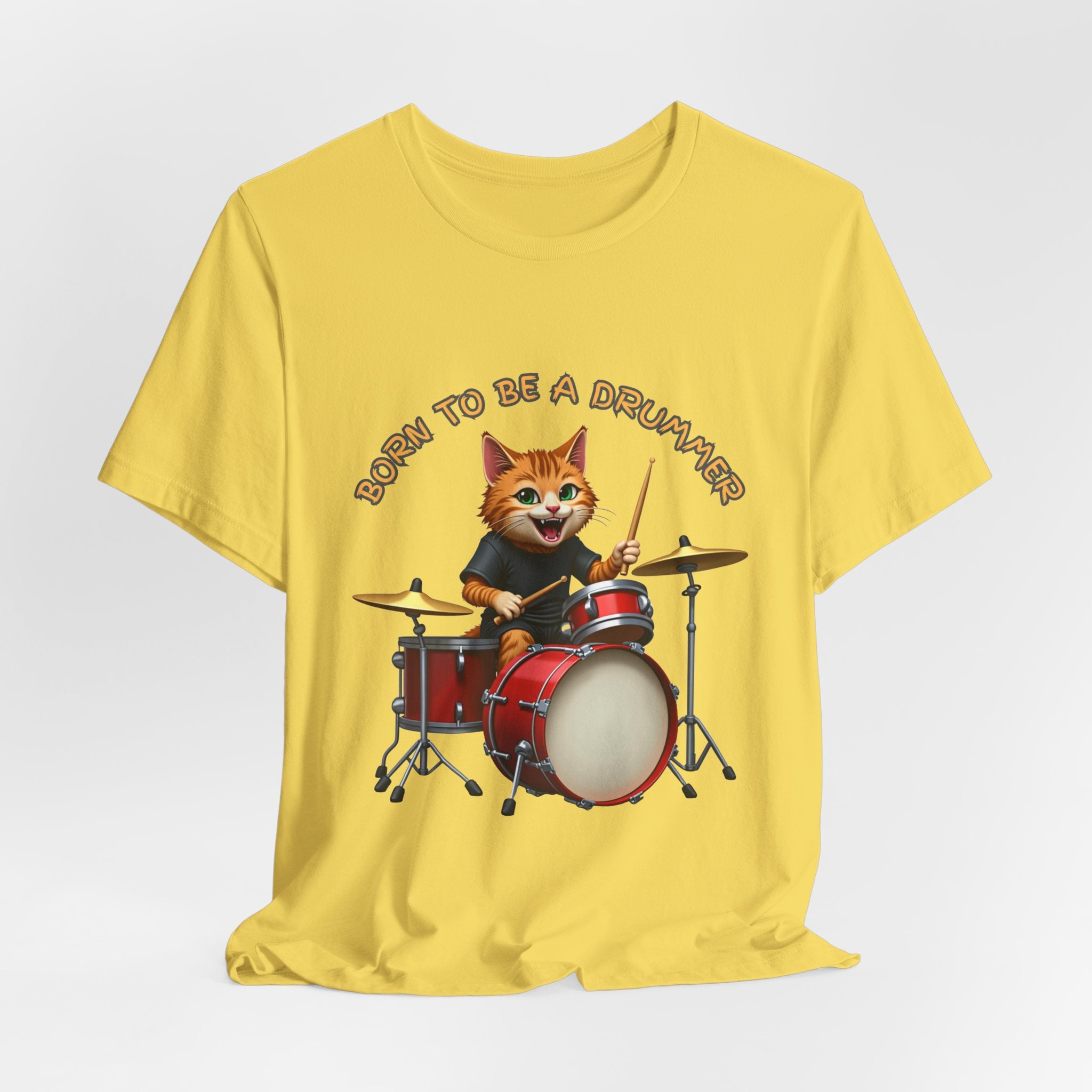Yellow t-shirt with a cartoon cat playing drums and 'Born to be a Drummer' text on a white background