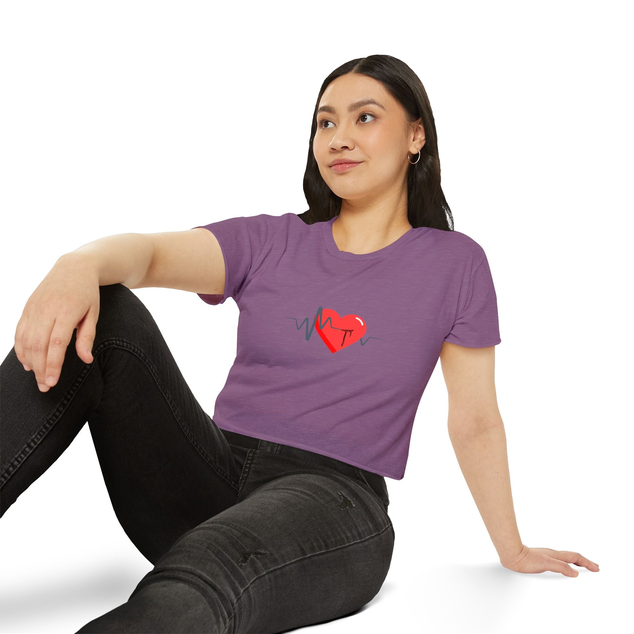 Woman wearing a purple t-shirt with a red heart design on a white background