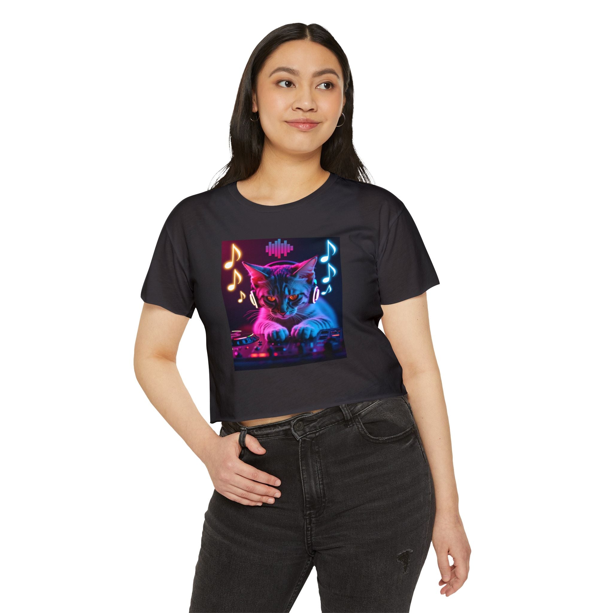 Person wearing a black t-shirt with a colorful cat graphic design on a white background