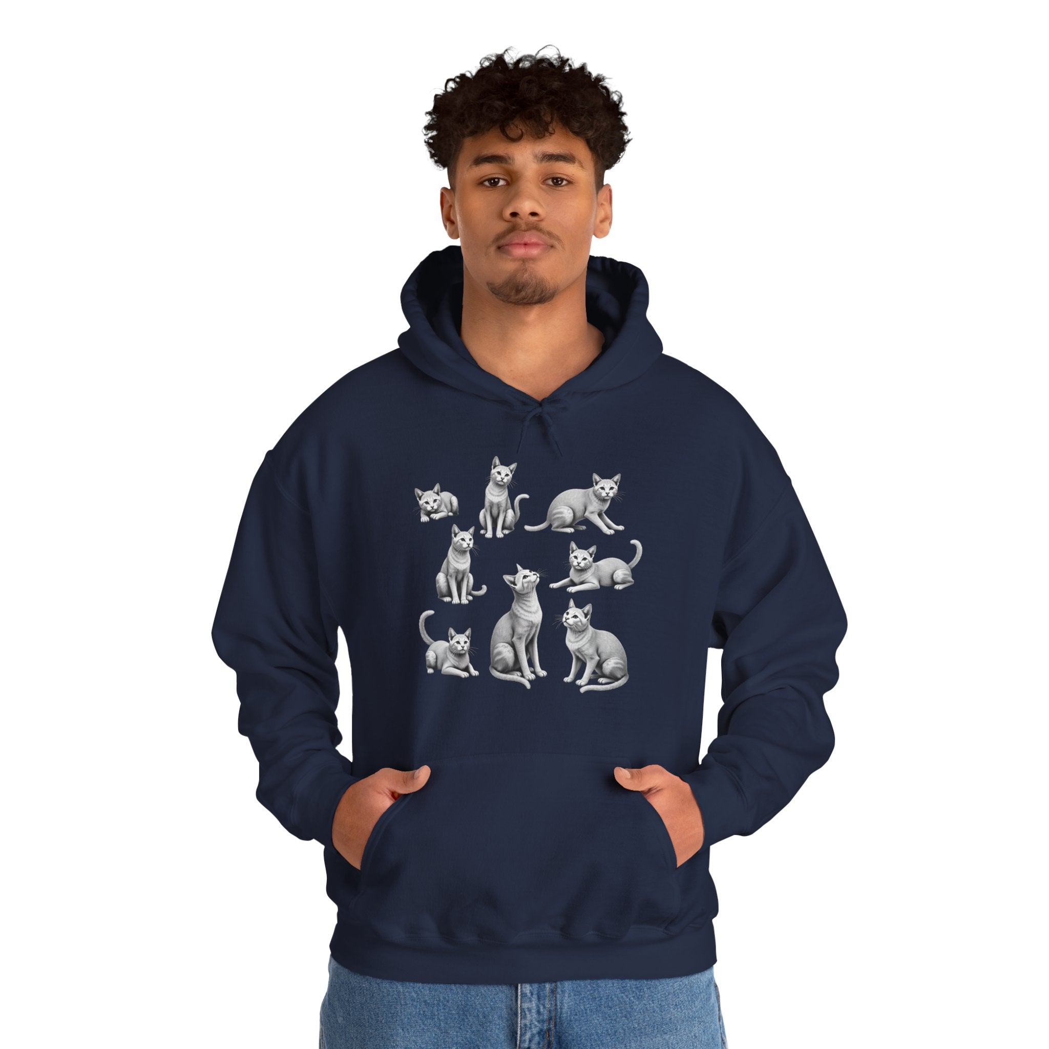 Person wearing a navy hoodie with cat illustrations on a white background