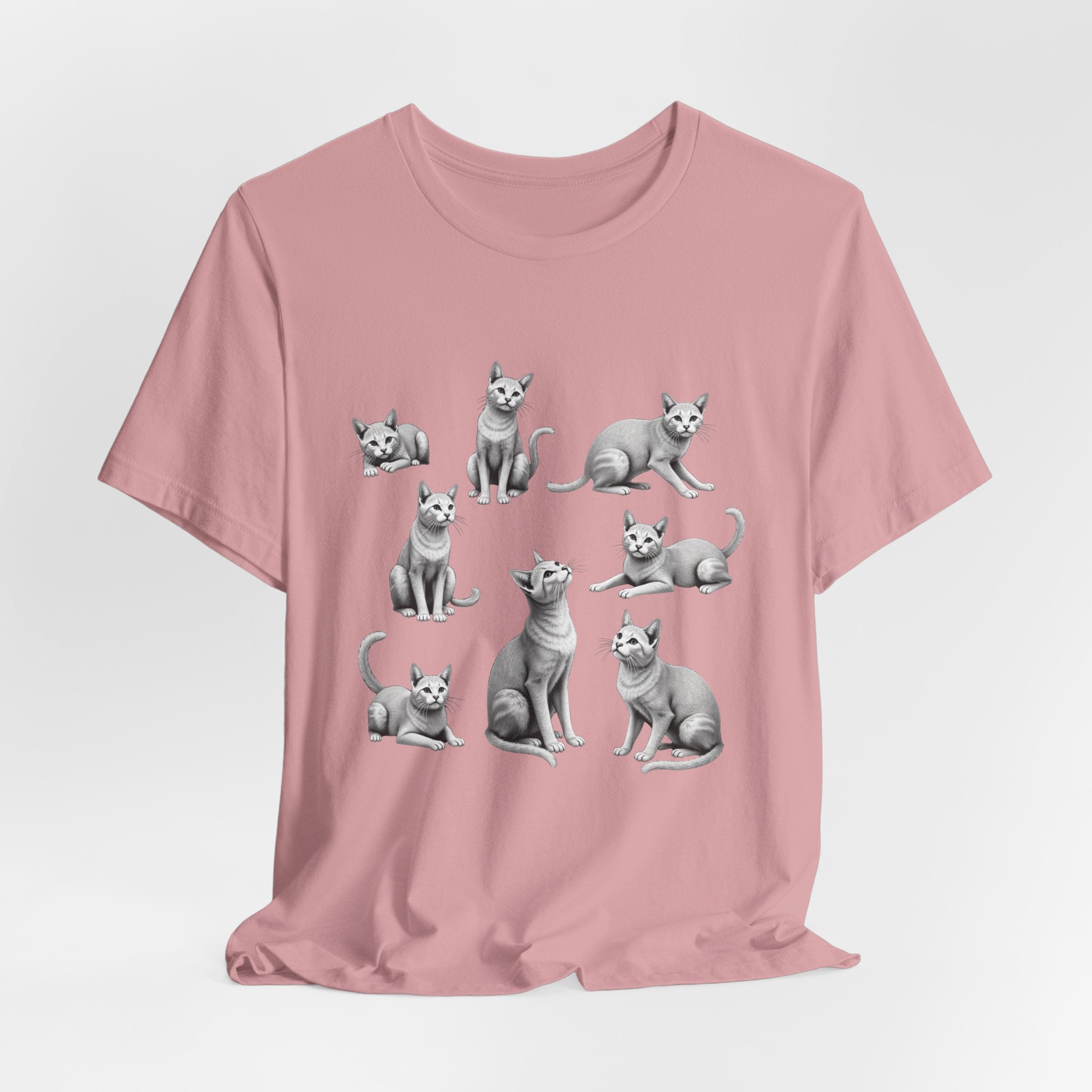 Orchid pink t-shirt with gray cat illustrations on a light gray background