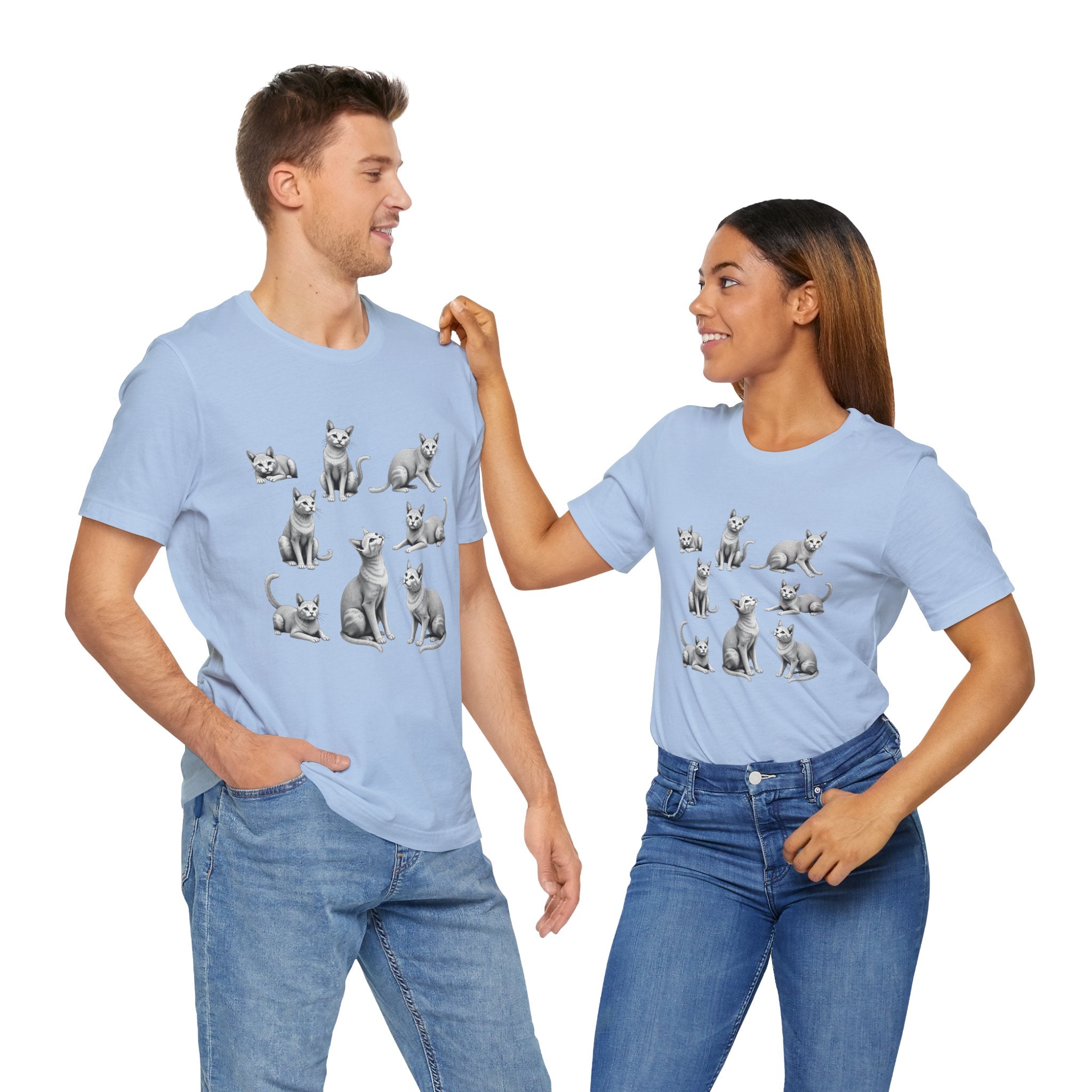 Two people wearing light blue t-shirts with cat illustrations on a white background